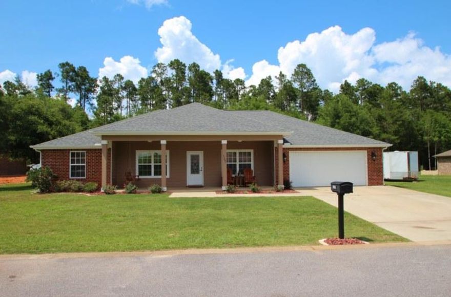 As a 2012 Parade of Homes entry this home has lots of bells and whistles! All brick construction featuring a Hardi-board accented roomy front porch. Builder put some of his best design ideas into this home! Tremendous kitchen with an abundance of beautiful wood cabinets topped off with Santa Cecilia granite countertops and tile backsplash. Double pantry holds lots of food and supplies on shelving that makes each item easily accessible. Under mount stainless steel sink, refrigerator with bottom mount freezer, dishwasher, disposal, smooth surface range, and microwave range hood. And that's just the kitchen!! The huge laundry room (see photos) is large enough for multiple cabinets, shelving, a folding table, and an upright freezer. It's a true ''mudroom'' with it's entrance from the garage.
