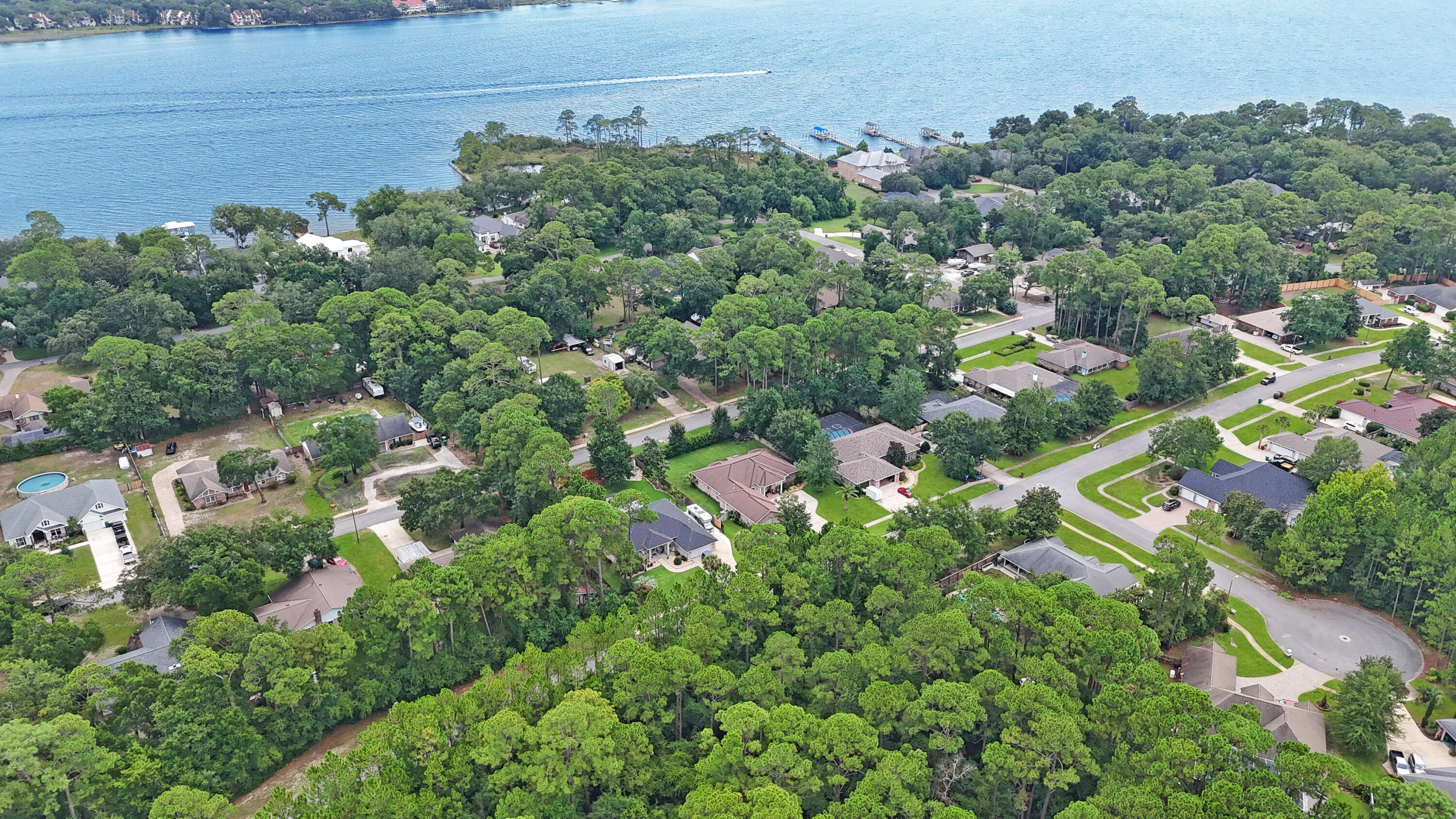 First Showing is July 27, 1-3 PM. Stunning home on a large lot with 11-ft ceilings, crown moulding, and trey ceilings throughout. Features 3 bedrooms plus a flex room, spacious living area with built-ins and gas fireplace, and a large Florida room. Expansive backyard is pool-ready. The master suite offers dual custom closets, separate vanities, walk-in shower, and oversized jetted tub. Kitchen has ample cabinets, and the dining area fits a large hutch and buffet. Guest powder room adds convenience. The 3-car garage is a showstopper with epoxy floors, utility sink, and storage. A perfect blend of comfort and style! Hurry and make this home yours today!! The Kitchen Appliances are only 3 years old, double wall oven. Along with a newer hybrid gas hot water heater.
Main floors replaced with lime stone based LVP for amazing durability only a year old. The gazebo and shed stay.
