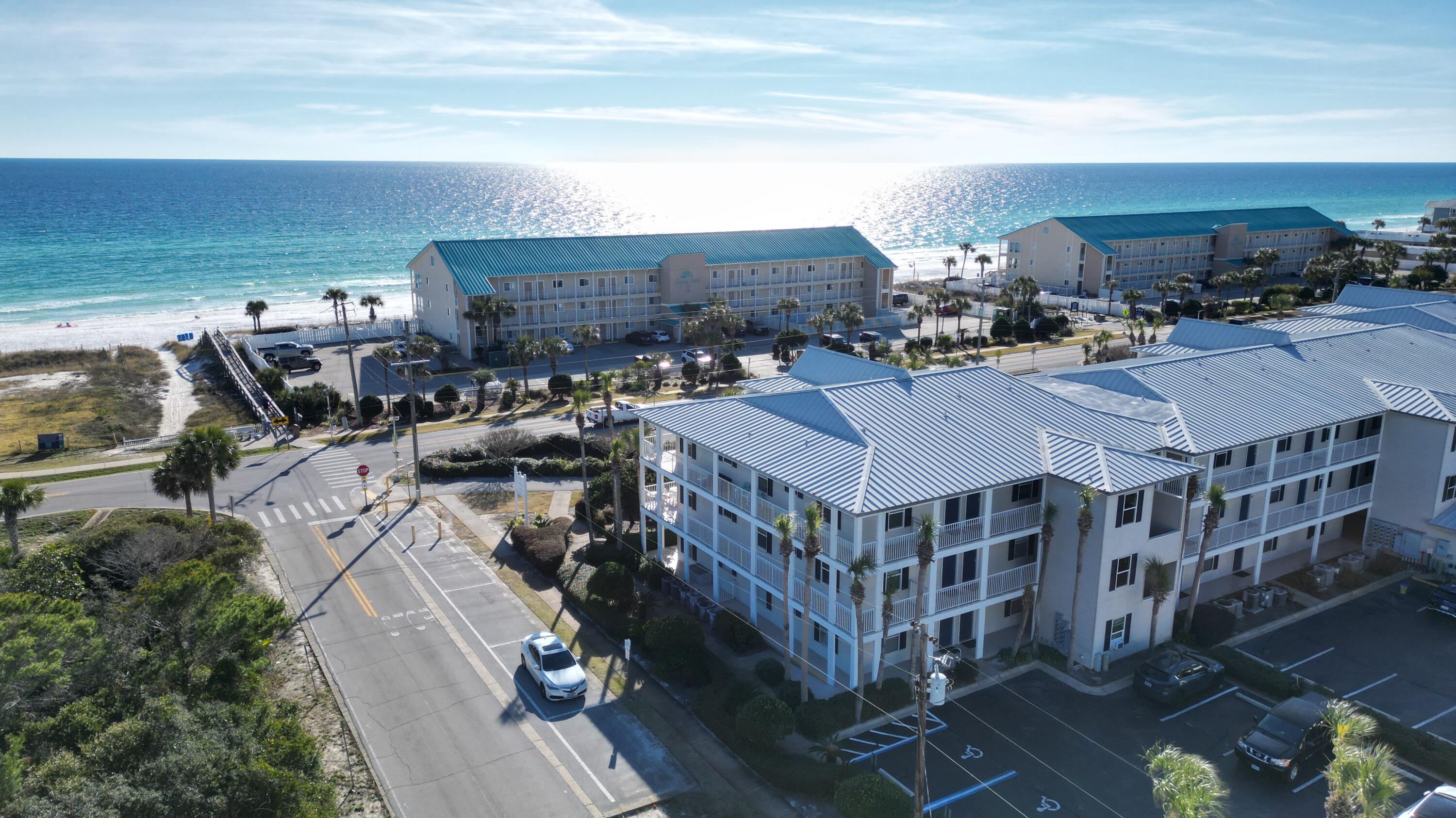 Top-Floor End Unit in Grand Caribbean Resort! Welcome to Unit 301, a meticulously cared-for and fully furnished end unit in the highly sought-after Grand Caribbean Resort, located in beautiful Destin, Florida. This rare top-floor gem offers an L-shaped wrap-around balcony, providing panoramic views of the Gulf of Mexico--perfect for savoring morning sunrises and evening sunsets.Step inside to discover a space that exudes modern coastal decor, featuring a fully equipped kitchen, a comfortable living area with a sleeper sofa, and 2 bedrooms with 2 full baths. This condo is as functional as it is stylish, boasting a washer/dryer for added convenience.The resort's impressive amenities include a heated outdoor pool, hot tub, barbecue area, and direct beach access, ensuring... ...endless relaxation and entertainment. With its prime location, you'll enjoy easy access to all of Destin's top attractions, dining, and shopping.

Whether you're looking for the perfect vacation retreat or a ready-to-go rental income generator, this condo checks every box. Don't waitthese rare finds don't last long!