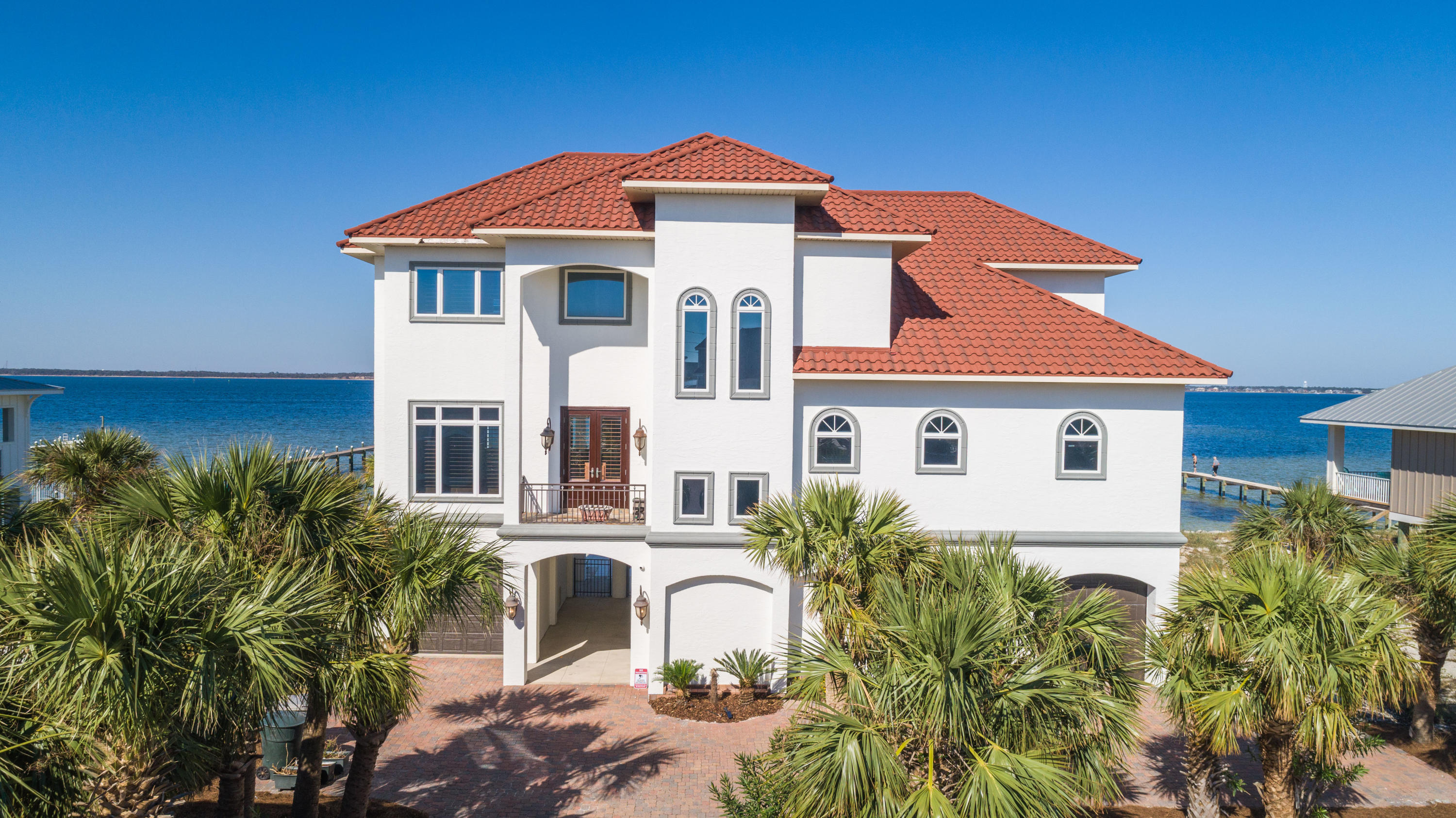 UNDER CONTRACT BUT TAKING BACKUP OFFERS. Situated on the Santa Rosa Sound with 105 feet of water frontage, this Mediterranean Estate was built to stand the test of time. With concrete pilings that go 38 feet down and ICF construction (Insulated Concrete Form), this fortress was well planned and has so many magnificent features. The chef's kitchen comes equipped with soft close custom cabinetry, Italian granite, 6 burner gas hood range, sub-zero fridge and wine fridge, LG wall oven and convection oven, ice maker, instant hot and cold water, and walk-in pantry. The impressive media room has a 1080P Anamorphic resolution projector with a 12 foot Microperforation screen, leather hydraulic recliners with seating for 8 pe