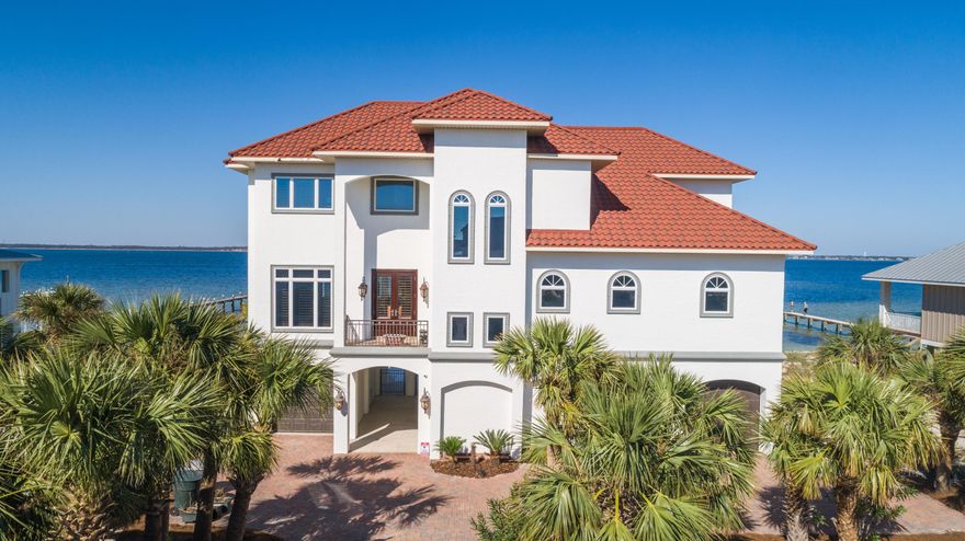 UNDER CONTRACT BUT TAKING BACKUP OFFERS. Situated on the Santa Rosa Sound with 105 feet of water frontage, this Mediterranean Estate was built to stand the test of time. With concrete pilings that go 38 feet down and ICF construction (Insulated Concrete Form), this fortress was well planned and has so many magnificent features. The chef's kitchen comes equipped with soft close custom cabinetry, Italian granite, 6 burner gas hood range, sub-zero fridge and wine fridge, LG wall oven and convection oven, ice maker, instant hot and cold water, and walk-in pantry. The impressive media room has a 1080P Anamorphic resolution projector with a 12 foot Microperforation screen, leather hydraulic recliners with seating for 8 pe