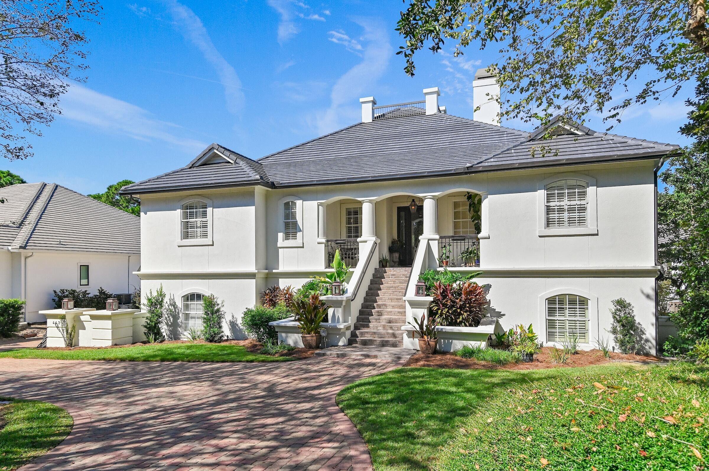 A premier, multigenerational Estate Home designed for convenience and comfortable living! Thoughtfully planned for flexible living and effortless entertaining, this 6-bedroom, 6-bathroom showplace combines luxury finishes with practical features to accommodate extended families and guests. Highlights include a separate office, an amazing chef's kitchen onthe main level, (complete with high-end appliances, large workspaces, multi-prep areas, a walk in pantry with abundant storage). There is also an entertainer's wine room, as well as a dedicated lower-level kitchen. The resort-style outdoor living space boasts a screened porch with its own built-in kitchen, overlooking a large saltwater pool, a relaxing hot tub, and a gas fire-pit. The main kitchen overlooks the outdoor living space and the first fairway of the award-winning Regatta Bay Golf Course. Zero step, accessible entry from the driveway with no stairs required to enter the house, and an elevator which provides convenient access to all levels. Sturdy concrete construction assures both durability and low maintenance, and a brand-new roof provides both lasting protection and peace of mind. Multiple garages and a circular driveway will accommodate multiple vehicles. Stress-free public beach access is just a short ride via a golf cart!