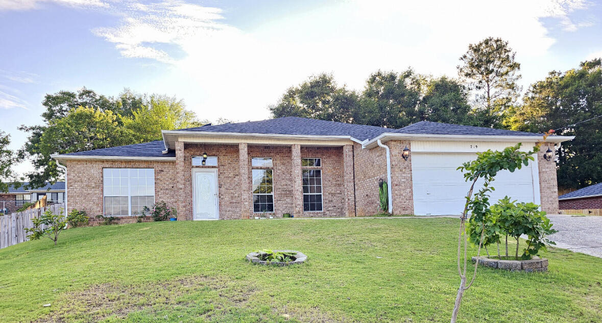 This stunning 4-bedroom, 3-bath home sits atop a hill in the sought-after Countryview Estates, just south of I-10--a prime location for easy commutes to Eglin AFB, Duke Field, and Hurlburt Field.Step inside to an open-concept design with high ceilings, abundant natural light, and a central kitchen--perfect for entertaining. The spacious family room seamlessly connects to the kitchen and dining areas, making it ideal for gatherings. The kitchen boasts stainless steel appliances, a center island, ample counter space, and a built-in desk.The primary suite offers a large walk-in closet, dual vanities, a soaking tub, and a separate shower. Two additional bedrooms share a convenient Jack-and-Jill bath, while a fourth bedroom and extra full bath provide space for guests or a home office 
Step outside to your private, fenced backyard, complete with a floating deck, pergola, pond, and mature fruit trees that produce apples, pears, peaches, persimmons, and bananasa true backyard oasis!

Say goodbye to high electric bills! This home features a fully paid-off, high-efficiency 10.95 kW solar system, slashing energy costs while reducing your carbon footprint. Plus, enjoy peace of mind with a brand-new roof (May 2024) installed by a trusted local roofer.

Located in a friendly, quiet neighborhood with mostly military and veteran families, this home is just minutes from parks, playgrounds, a water area, and a disc golf course. The school bus stops right at your driveway, and childcare is available at the end of the street.

