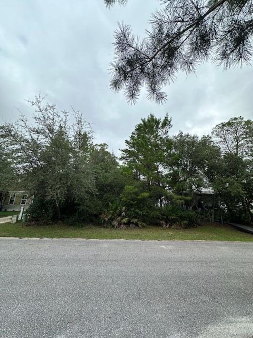 Big price drop -$60,000!!!  Vacant building  lot in popular and growing Point Washington area..  Close to Destin, Panama City and Northwest Florida  Beaches Airport.  Lot is situated on quiet dead end lane in a conforming neighborhood.  Public boat launch just one block away onto McQuage Bayou - which allows access to Choctawhatchee Bay, Crab Island and the Gulf of America.  Just 10 minutes to world class beaches on the Emerald Coast. and all that Scenic Hwy 30A has to offer. Schools, medical and shopping also close by.  County owned nature area right across Laurel Oak Lane.  Take a look today at this building lot in a dynamic growth area.