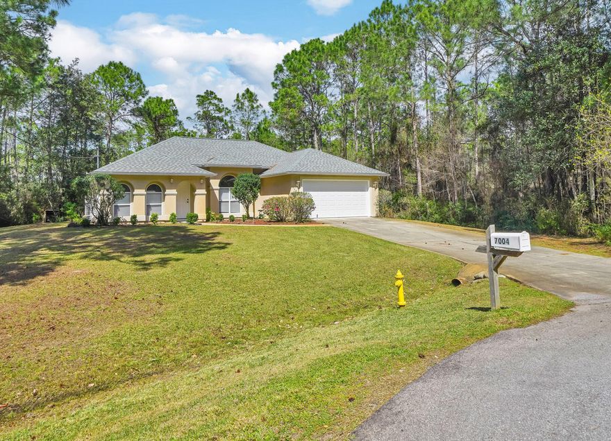 IMMACULATE CONDITION!  Recent renovations include: newly painted, new kitchen and bathroom countertops, new roof with architectural shingles installed in 2019, luxury vinyl plank flooring throughout, HVAC and heat pump installed in 2018, new ductwork, gutters, landscaping, termite bond, Emergency Power Switch, Insulated Garage Door.  Enjoy the tranquility in this lovely mediterranean style 3 bedroom, 2 bathroom home surrounded by woods, drink your morning coffee in your screened in back patio and enjoy the sounds of nature.  This beautifully laid out open home is perfect for entertaining or for quiet evenings with the family!  No through traffic with the home situated at the end of a cul-de-sac!  Amenities at Holley By The Sea include Pool, Sauna/Steam Room, Exercise Room, Community Room, BBQ Pit/Grill, Beach, Boat Launch, Fishing, Pavillion/Gazebo, Picnic Area, Playground, Tennis Court.  Welcome to your new home!