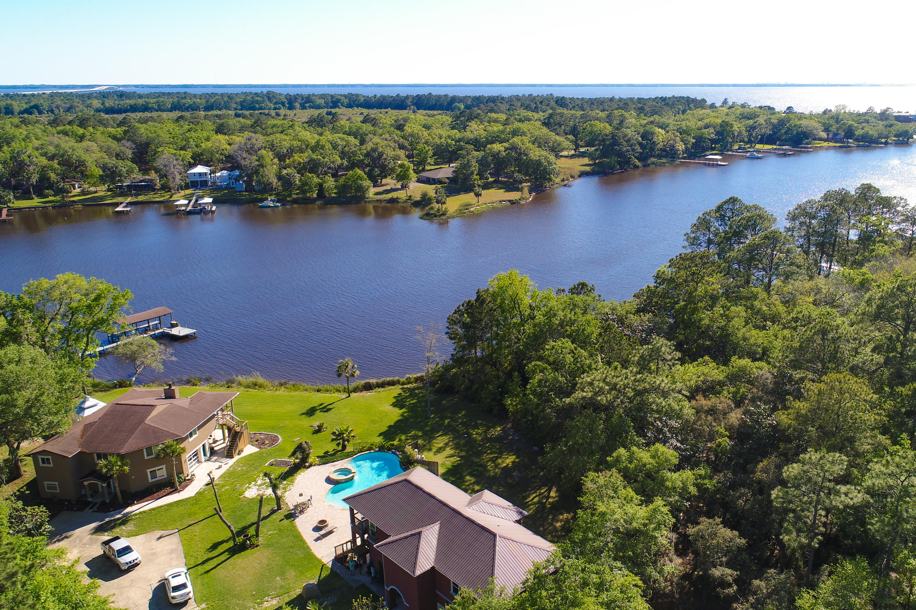 Located on picturesque Lagrange bayou, this Caribbean style custom home is move-in ready with lots of amenities. With absolutely beautiful waterfront views, this two story beauty has an elevator, gourmet kitchen, easement to the long landscaped driveway, and beautiful yard. The interior includes high-end appliances, fixtures, paint and flooring. A custom pool, spa, and pool deck on the waterfront side of the home, provides a perfect combination of natural bayou front surroundings with a crystal clear watering hole. This secluded gem boasts an extremely oversized two car garage forautos, toys and more. Buyer to verify all information.