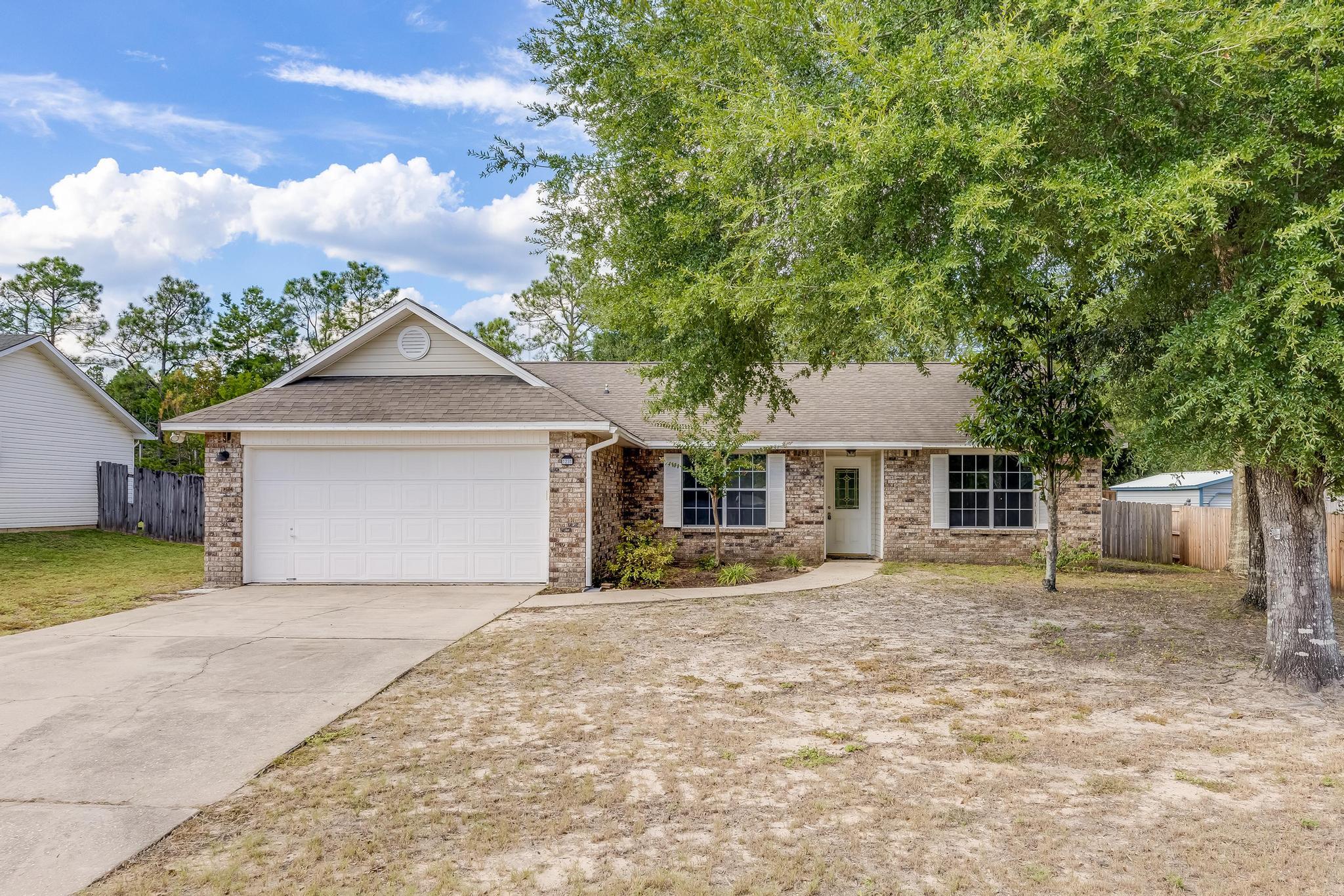 This 4 bedroom/2bath/ 2 car garage home is conveniently located South of I-10 in the sought after subdivision of Countryview Estates. Popular split bedroom design. Tile or new LVP flooring throughout the home.  Family room has wood -burning fireplace, plant ledges, connections for surround sound, large sliding door leading to screened Florida Room. Large eat-in kitchen with center island, pantry, and plenty of cabinet and counter space. Master suite is to right of entrance with double vanity, garden tub, separate shower & large 10x6 closet! Additional bedrooms are nice sized with ample closet space. Privacy-fenced back yard w/double gate on left side of house. Roof replaced with dimensional shingles in 2014, Water heater 2022. Schedule your showing today!