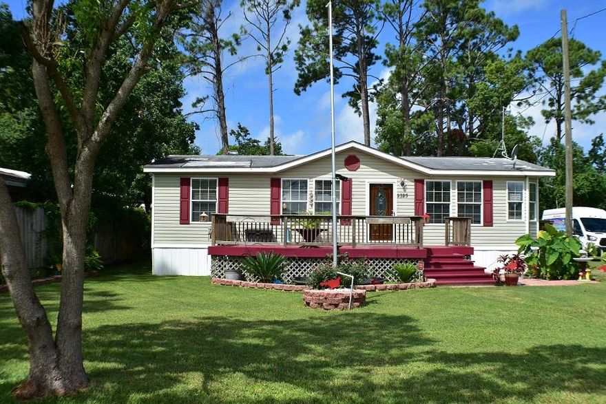 New metal roof being installed on this 3BR/2BA modular home! The seller also put new carpet in the master and second bedroom. Features include wood laminate and ceramic tile flooring, walk-in closets, jacuzzi tub in the master bath, crown molding, a Trane 3-ton AC, a two car carport in the back, and the seller says there is sewer hookup available. This home is conveniently located in the heart of Panama City Beach near shopping, dining, nightlife and the Navy base. Great curb appeal and the seller is leaving the flag pole too! All info is approx and must be verified by Buyers if important.