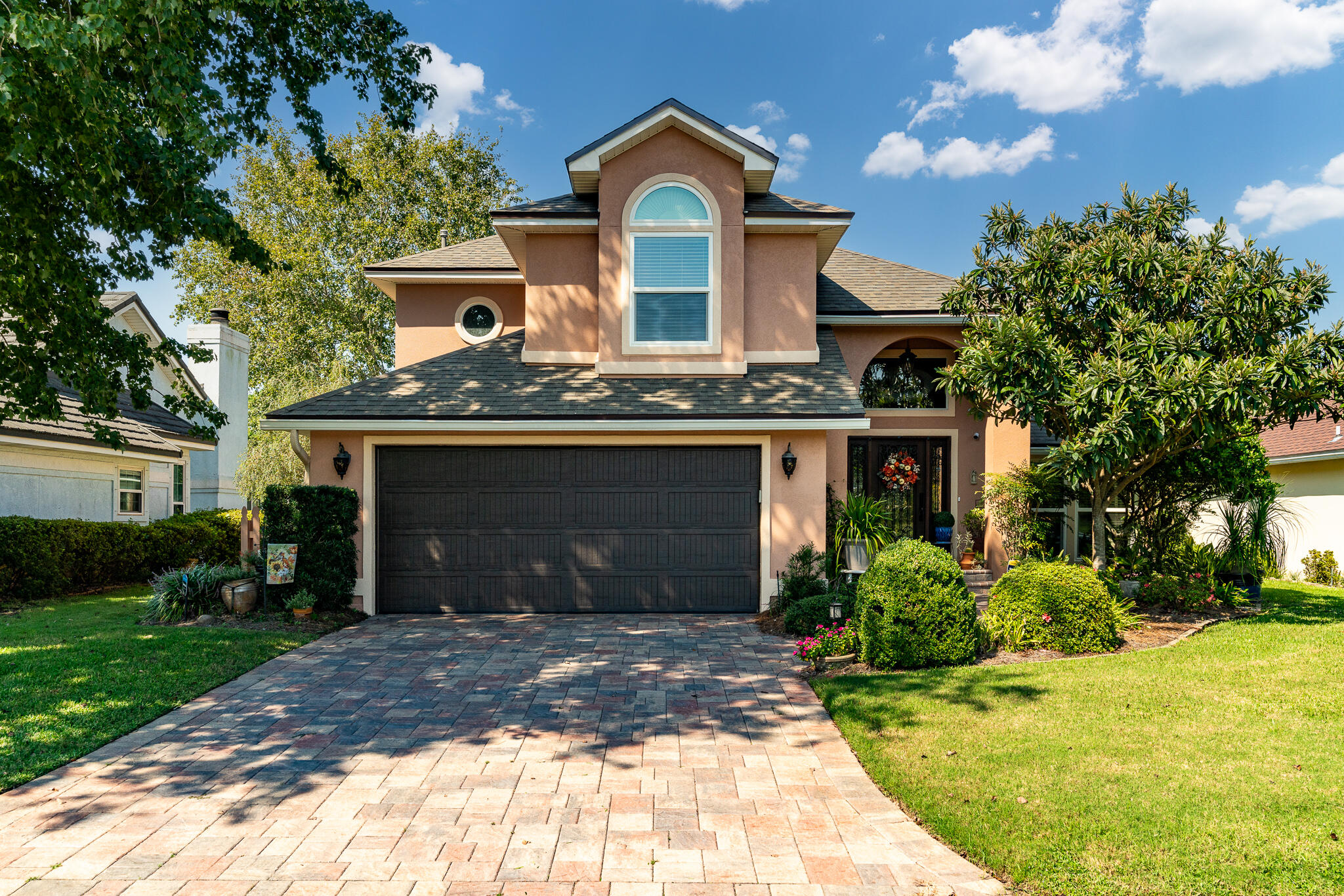 This inviting home, nestled on a small lake along the 3rd fairway of the Shalimar Pointe Golf Course, offers a perfect blend of modern updates and cozy charm. With 3 bedrooms and 3.5 baths, the layout is thoughtfully designed for comfort and functionality. The master bedroom and bath are located on the first floor, providing easy access and privacy.The updated kitchen, featuring sleek quartz countertops, soft-close doors and drawers, and convenient cabinet organizers, overlooks a spacious dining and living area. A stunning double-sided fireplace separates the two areas, adding both warmth and ambiance to the open floor plan. The recently enclosed patio,  with glass windows, creates a cozy retreat with lovely views of the lake and golf course.Upstairs, a versatile loft space awaits, perfect for a play area, second living room, or home office. With plenty of natural light and the same tranquil surroundings, this space offers endless possibilities. 2 bedrooms with 2 well-appointed bathrooms on this level ensure convenience and privacy, with modern fixtures and thoughtful layouts. 

Whether you're relaxing by the fireplace, enjoying the view from the patio, or retreating to the loft, this home is a peaceful haven with a sense of warmth and elegance.