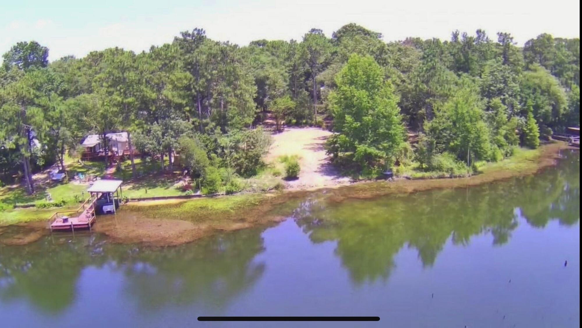 .99 acres lot w/ an estimated 165' of Waterfront on Kings Lake, Septic System, City Water & Power.  The home that was on this lot was recently removed given the new owners a clean slate to put their dream home!   This peaceful lot is tucked away in a quiet cul-de-sac, directly on the water w/ plenty of trees for shade and privacy.