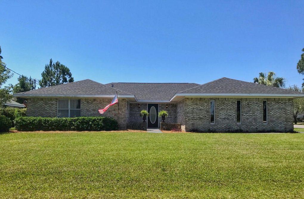 MUST SELL ... WILL SACRIFICE! Exceptional well maintained home in thriving Miramar Beach, situated just 1 mile to the sandy white beaches! Huge corned lot affords tremendous privacy. As as soon as you enter, you will be amazed with the enormous open floor plan with two master suites & private baths (one of which can be converted to a third bedroom), a two sided gas fireplace that sits between the living and dining areas , heating the whole home. Relax on the covered back patio opening to the oversized manicured back yard which can easily accommodate a swimming pool!
