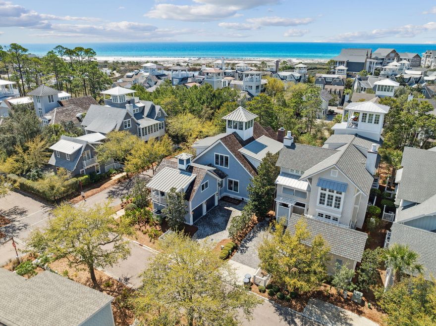 Totally remodeled Watersound Beach home with room for all your family and friends has 6 BRS in the main house, 2 on the main floor including the primary suite with 4 Ensuite Bedrooms Upstairs is ready to call your own!  You will find an additional king bed in the carriage house which has a full kitchen. The home boasts high-end finishes, quartz and quartzite countertops, and a brick fireplace. Upstairs and downstairs living areas provide room for everyone to spread out.  The kitchen is well-planned with high-end appliances and an island with bar stools.Enjoy outdoor living on the porch with retractable screens.Privacy is assured as the corner lot backs onto a nature conservation area.The Owners did not rent, but what an amazing rental it would be!There is so much more! The strategic location places you close to all Watersound Beach has to offer. You are close to the fitness center, and the golf cart path to the Private Watersound Beach Club with all of its amenities is right across the street. Watersound also provides two golf cart paths through the white sand dunes for you to be able to reach over a mile of our private white sand beaches and beautiful blue and emerald green waters of the Gulf. 
A spiral staircase on the second floor takes you to the tower room with panoramic views to catch sunsets and share a glass of wine. This home checks off all the boxes for ''your special place at the beach''.