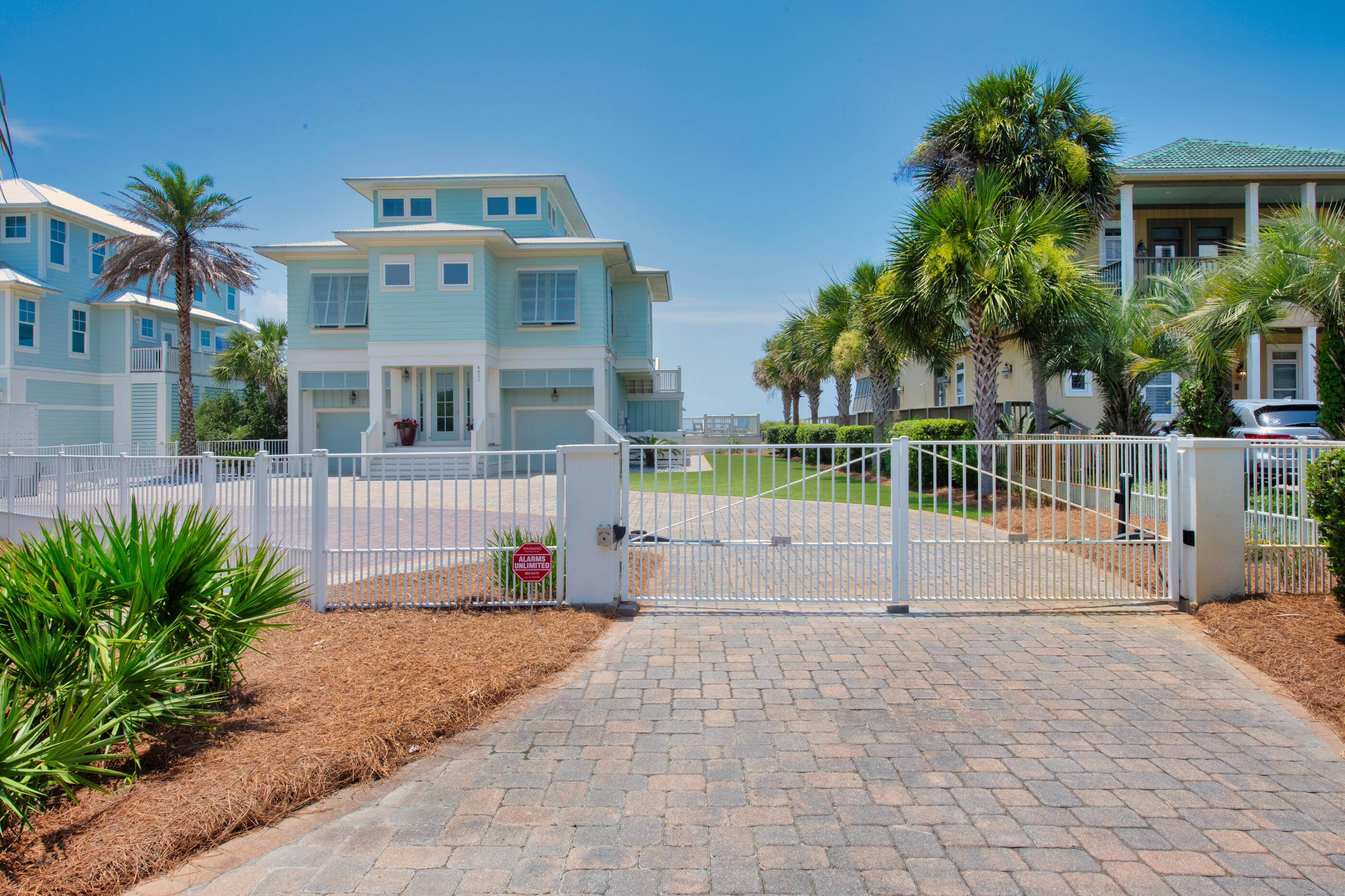 Enjoy gorgeous panoramic views of sunrise and sunsets over looking the white sandy beaches on the Gulf of Mexico from your gated, gulf front estate. First floor has 2 large bedrooms with ensuite.  Walk out of either bedroom & enjoy your gulf side swimming pool, covered patio, large swing & private beach walkover. From the 1st floor you can access the 2 separate garages and there is additional storage under the stairs. Going to the 2nd floor, you are greeted with a large open floor plan with kitchen, dining area & living room overlooking the gulf. Two additional guest bdrms with ensuite , a guest bathroom with shower, separate laundry room with sink & ice machine with plenty of storage.  The master suite is on the 3rd floor with open deck to absorb the sun & watch the dolphins play.