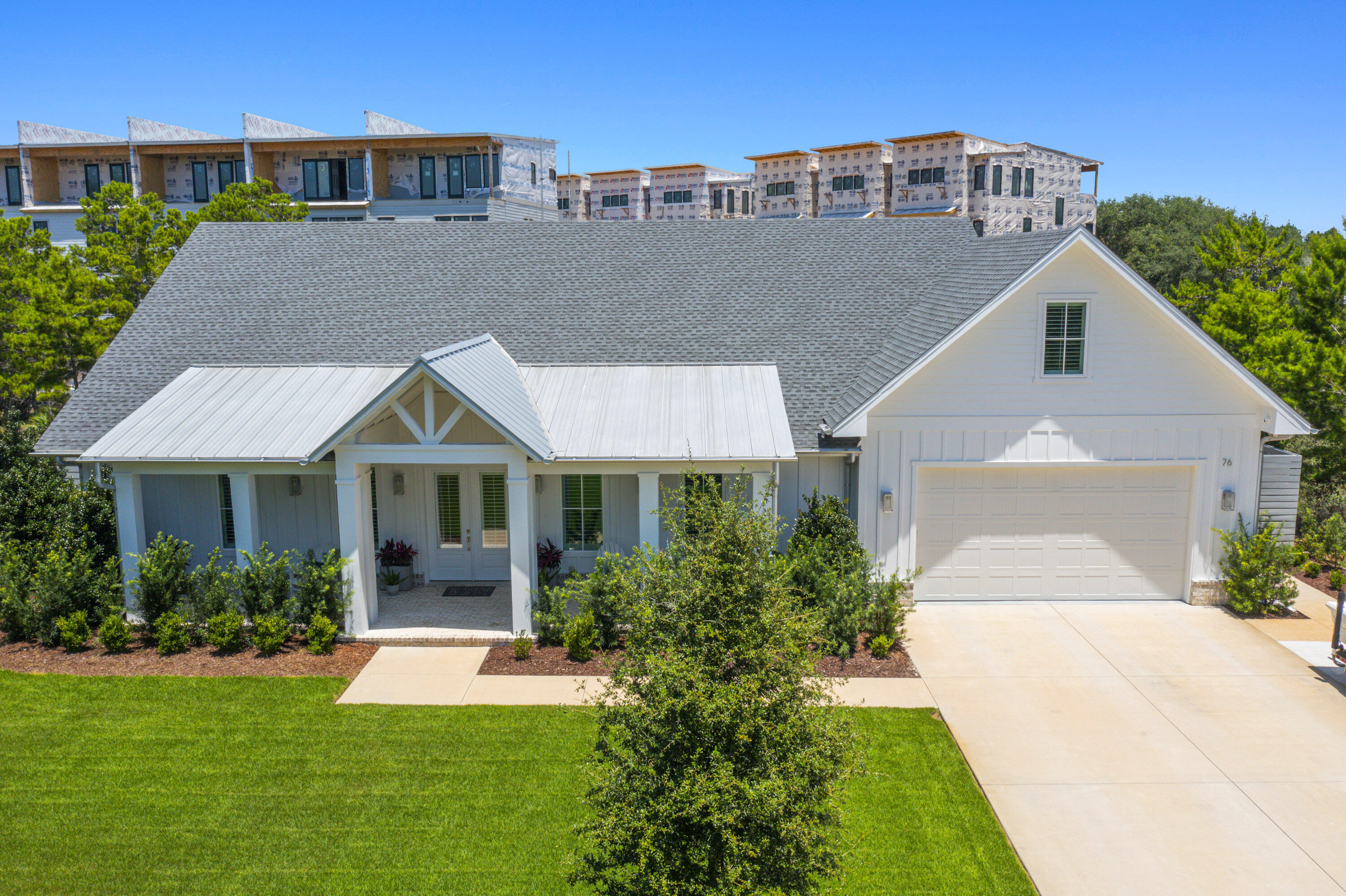 Welcome to 76 Tanglewood, a well-designed two-story home on the West end of 30A. Built in 2022, this five-bedroom, four-bath property offers over 4,000 square feet of living space on a large lot with no HOA and short-term rentals allowed. The open main level includes a bright living area, spacious kitchen, dining space, and three bedrooms--one can be used as an office. The primary suite overlooks the pool and features a large bath with soaking tub and walk-in shower. Upstairs offers a second living area, two bedrooms, full bath, and bonus room. Outside, enjoy a private pool, covered porch, and a two-car garage - all just minutes from the beach!