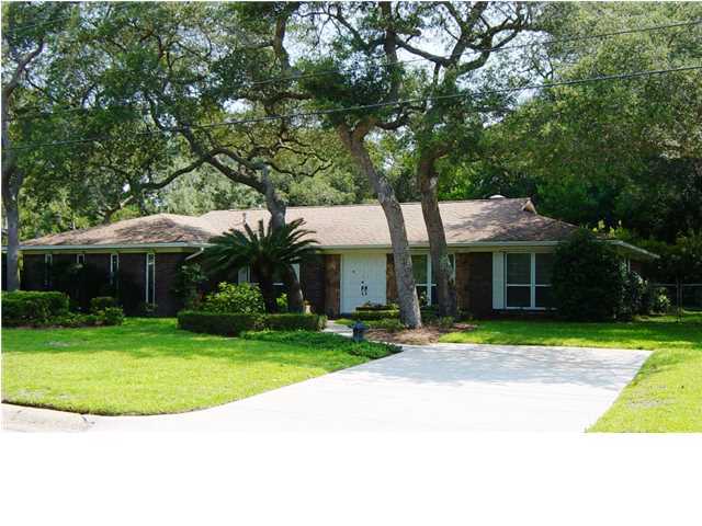 Immaculate Home on a 1/3 Acre Corner Lot Located in a Great Neighborhood in the Heart of Fort Walton Beach! Just 10 minutes from Eglin AFB, Hurlburt Field, and the Beaches. Maintained with a pride of ownership you'll notice the minute you pull up. The meticulous landscaping is second to none. Please take the time to look at the pictures provided as words can't do the beauty of this home justice. Built in a solid ALL BRICK exterior with Hardie Plank accents this home also is equipped with CUSTOM HURRICANE SHUTTERS that convey and provide a nice discount on homeowner's insurance. All COPPER WIRING as verified by recent home inspection. Inside beautiful wood flooring covers the Spacious Living Room that features a DUAL GAS FIREPLACE shared with the Florida Room. The Large Kitchen is open
