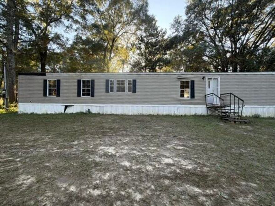 This REO mobile home rests on approximately 0.60 acres. Home was built in 1988 and is 1216 square feet with split bedroom design. Home has 3 bedrooms and 2 full baths, vaulted ceilings, kitchen island. Home will not qualify for financing. Cash only. Due to interior condition, no interior access will be allowed, therefore purchasing as is with no interior access.