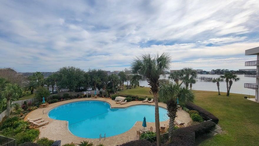 Welcome to effortless coastal living in this beautifully updated and fully furnished studio condo in Pirates Bay--complete with a deeded 40' boat slip (C9)! Located on the 3rd floor, this charming 325 sq ft unit offers breathtaking views of the Santa Rosa Sound and showcases high-end upgrades throughout.Step inside to find wood-look ceramic tile flooring, quartzite countertops, and matching soft-close custom cabinetry that blends seamlessly across the kitchen, bathroom, and built-in office space. The handcrafted queen-size Bedder Way Murphy bed is painted to match the cabinetry, maximizing both style and functionality.The kitchen is fully equipped with a stove, microwave, dishwasher, and refrigerator--perfect for full-time living or a weekend retreat. The sleek bathroom features a glass-enclosed tiled shower with bench and dual niches, plus ample cabinet storage. A full-size stacked washer/dryer and generous closet add everyday convenience.

Enjoy morning coffee or evening sunsets from your private balcony overlooking the pool and water. Pirates Bay amenities include a gated pool, BBQ/picnic area, and a private beach launch for paddleboards and kayaks. The marina offers electricity and water, and slips may be rented separately for passive income.

HVAC and water heater replaced in 2018. Popcorn ceilings removed and finished with elegant crown molding.

This turn-key waterfront condo is the perfect mix of style, comfort, and coastal convenience boat slip included! The Boat slip HOA is a separate $447.53 a quarter. 