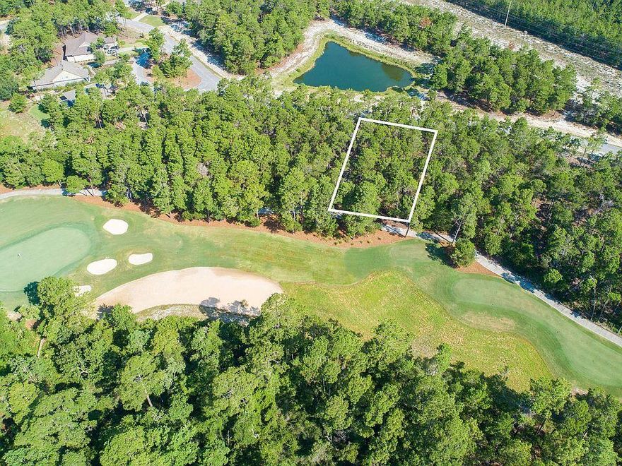 ONE OF THE LARGEST LOTS IN WILD HERON (LOST COVE LANE) BOASTING OVER A HALF ACRE! Great deal in Wild Heron! This 11th fairway lot is being offered for the low price of $78,000. Motivated seller, bring all offers! Golf Course Residential Lot on the beautiful 11th Fairway of Greg Norman's Sharks Tooth. Convenient to the Clubhouse, Pro Shop & Driving Range. Prospect Point is home to the lakeside Fitness Center, Pool/Hot Tub, Owners Library, Boardwalk, Fire Pit & Community Dock. The Boat House features canoes & kayaks for owner use on Lake Powell. There are membership opportunities available for Golf as well as the Watercolor Beach Club. Come experience the lifestyle that Wild Heron has to offer. You will find a true sense of community here.