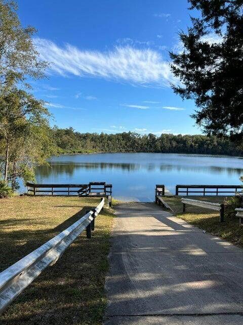 Love Golf? Dream of having a home built in proximity to your clubhouse and golf course without paying high HOA fees? This .331 acre lot is perfect for you. Other than the clubhouse and beautiful Green Golf turf, Sunny Hills offers numerous lakes with white sandy beaches and clear water throughout for recreational activities such as swimming, boating, and fishing, but also provides a short drive, approximately 45 minutes to Panama City beaches when you want to visit a different slice of heaven. Northwest Florida Beaches International Airport, and Pier Park shopping are approximately 45 minutes. Approx. 20 miles from local shopping, medical, and other local amenities in Chipley.