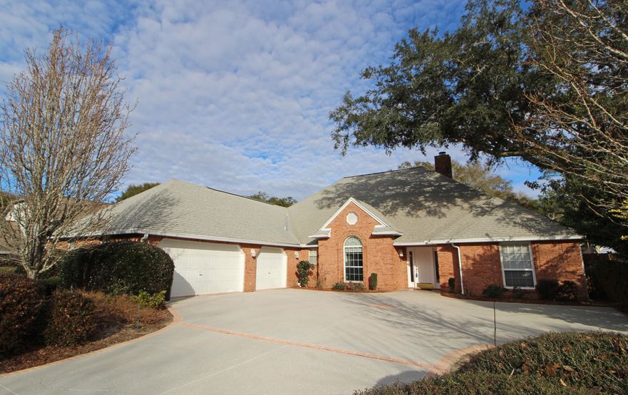 PRESTIGE HOME IN A PREMIER LOCATION! From the minute you drive up you'll be impressed with the fantastic curb appeal. Step inside the tiled entry with vaulted ceiling. Spacious living area with beamed cathedral ceiling, beautiful hardwood flooring, built-in bookshelves and entertainment center, gas fireplace with custom wooden mantle, wet bar for entertaining and french doors that lead out to a sunroom. Formal dining room could also be used as an office/den. Kitchen is designed with pride, lots of solid wood cabinetry to include built-in desk and wine rack, counter space galore, center island with power and a breakfast bar. Breakfast area overlooks the pool and has a door leading to the sunroom. Master bedroom suite has trey ceiling and a large walk-in closet. Master bath has