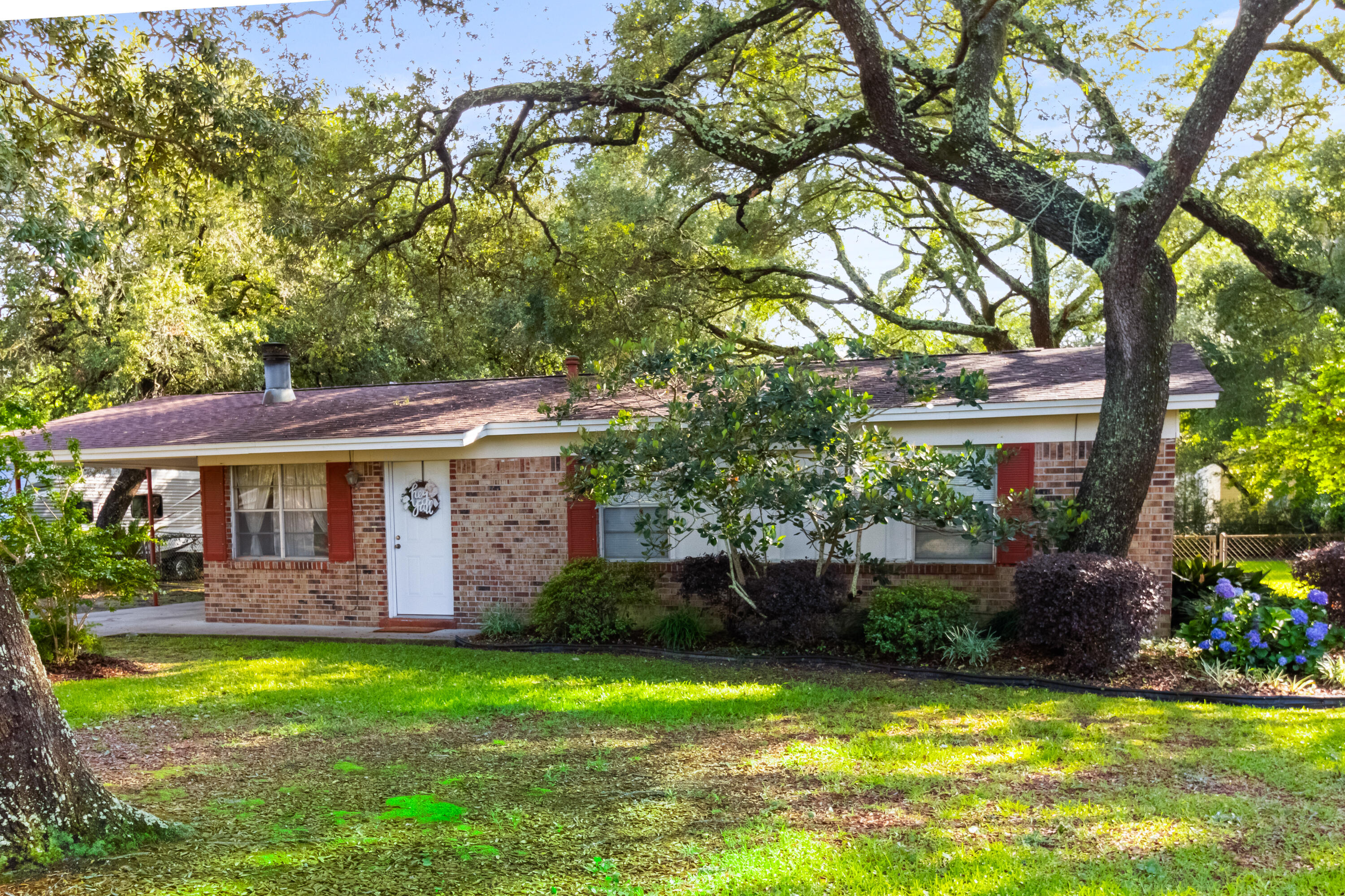 Come check out this charming mid-century home nestled in a quiet, established neighborhood.This home features an open layout with ample natural light, making it perfect for comfortable living. A few finishing touches will complete enclosing the Florida room, or it could easily be converted back to a screened in porch. The large lot provides plenty of outdoor space for gardening, entertaining, or future expansion. With its prime location this property presents an excellent opportunity for investors or first-time home buyers looking to personalize their space. Don't miss out on this fantastic opportunity to own a piece of Fort Walton Beach charm.Roof 2018* HVAC 2018* New tile, trim and vanity in half bath 2025