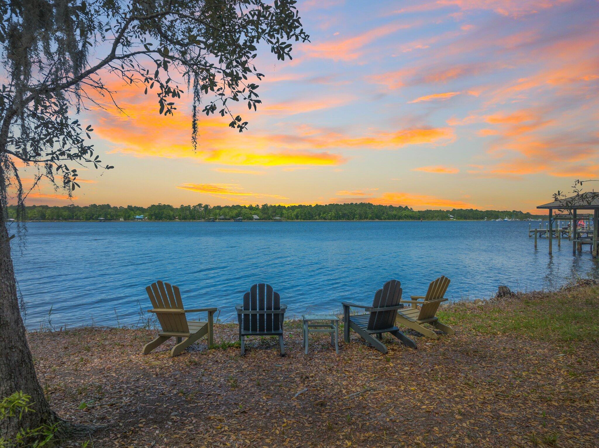 This beautiful homesite featuring 102 feet of protected Lagrange Bayou frontage with deep water access for larger boats, is now offered for sale! This premium lot is a rarity to our market, unmatched in location, flexibility, and quality featuring wide layout adorned with mature oaks resting about a peaceful road with little through traffic. The property is already gated, manicured and surrounded by million dollar homes with the added benefit of privacy. No HOA and no build out time allows you the buyer to take possession and build at your own pace. Plenty of room for a main house and carriage home with ample frontage for a private waterfront dock. The beaches of 30A are a mere 10 mins away with grocery and ample dining selections close by. A full service marina is located directly across the Bayou, and it's only 2 minute boat ride to direct Choctawhatchee Bay access. Experience the best in Florida living along the Gulf Coast right here at Holly Point Rd.!