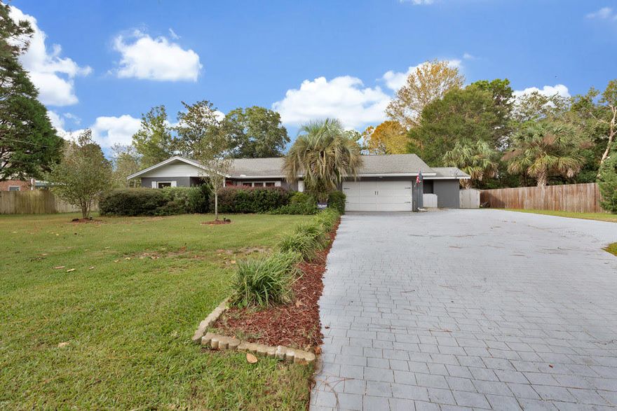 This MOVE IN READY home has an effective age of 2000.  It is in a great location with a waterfront park in walking distance.  The park has a boat launch swimming.  This four bedroom home has an open and roomy with many upgrades.  The master bedroom has 2 closets (one is a walk in) with an entry to the Florida Room.  The kitchen is bright includes a gas stove and granite counters.  The floors are plank laminate with new carpet in the spare bedrooms.  The home is updated while  keeping it original charm.  Parking for a boat or camper with hookups.  The backyard has a workshop.