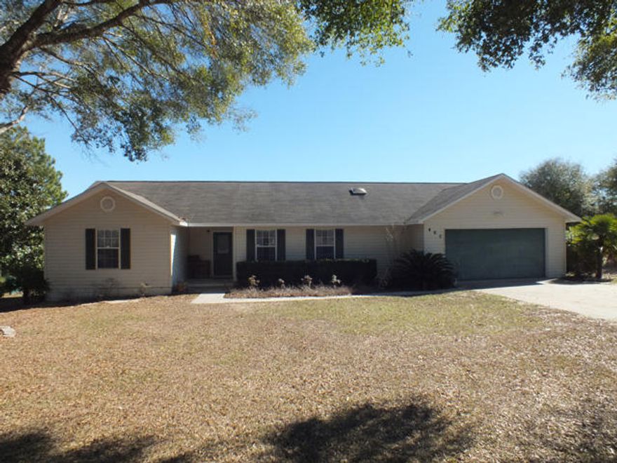 Lovely waterfront home in Hidden Lakes Estates, just minutes from historic downtown DeFuniak Springs. The home sits on a 1/2 acre lot with 190 feet of frontage on Magnolia Lake. The open concept floor plan features a wood-burning fireplace in the living room, which also opens onto the back porch through sliding doors, and separate dining and kitchen areas. The back yard is completely fenced and has a walkway onto the large dock.
