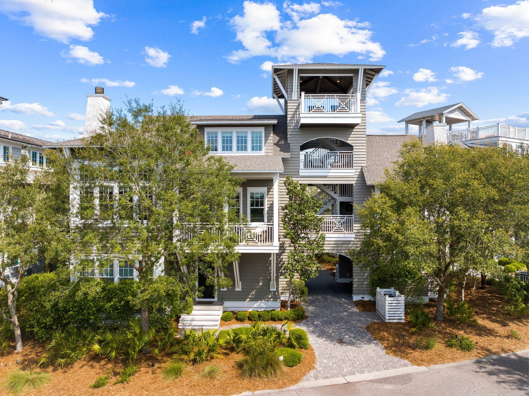 Occupying one of the largest lots in WaterSound Beach, this outstanding craftsman home boasts exceptional design features. Enter the courtyard through a covered entrance and pass the fountain, fire pit and detached office as you enter this magnificent retreat. Designed by Thurber Architecture and built by Rice Construction, a fourth-story tower with panoramic views of Camp Creek Lake and the Gulf of Mexico creates a breathtaking pinnacle. Multiple porches on all levels provide a plethora of outdoor spaces to enjoy stunning skies at sunrise and sunset. Second floor main living and dining areas boast soaring ceilings and pecky cypress accent walls highlighting the finer points of this luxuriously appointed home.