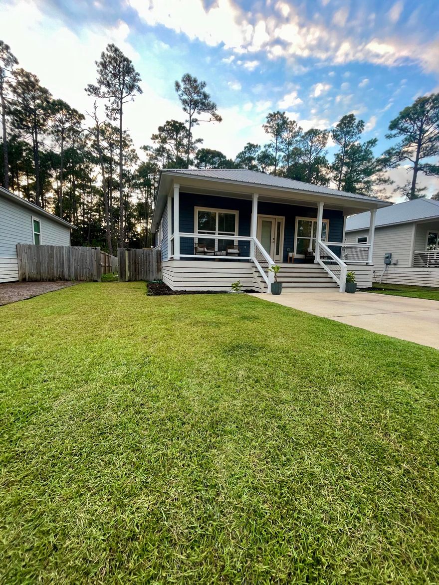 This perfectly maintained cottage has one of the best outdoor living setups you will find. The large covered patio was professionally built and wired by a licensed electrician. The space is outfitted with two mounted TVs, mini fridge to put 6 packs of soda in... string lights, and a ceiling fan. It is the ultimate game-day or  family friendly space. Inside, every system is in excellent working order and the home has been consistently serviced and maintained. The front porch was recently painted and stained, and the backyard features a paver walkway leading directly to the covered patio. The yard is fully fenced, manicured, and ideal for anyone with pets. Cute dogs only. The location is a major advantage. You can walk to the bay in minutes and the beach is only a few miles away. This property offers easy access to everything while still sitting in a quiet residential setting.

Tenant is responsible for utilities. The home is clean, updated, and will be ready for occupancy between 1/1/2026 - 1/15/2026