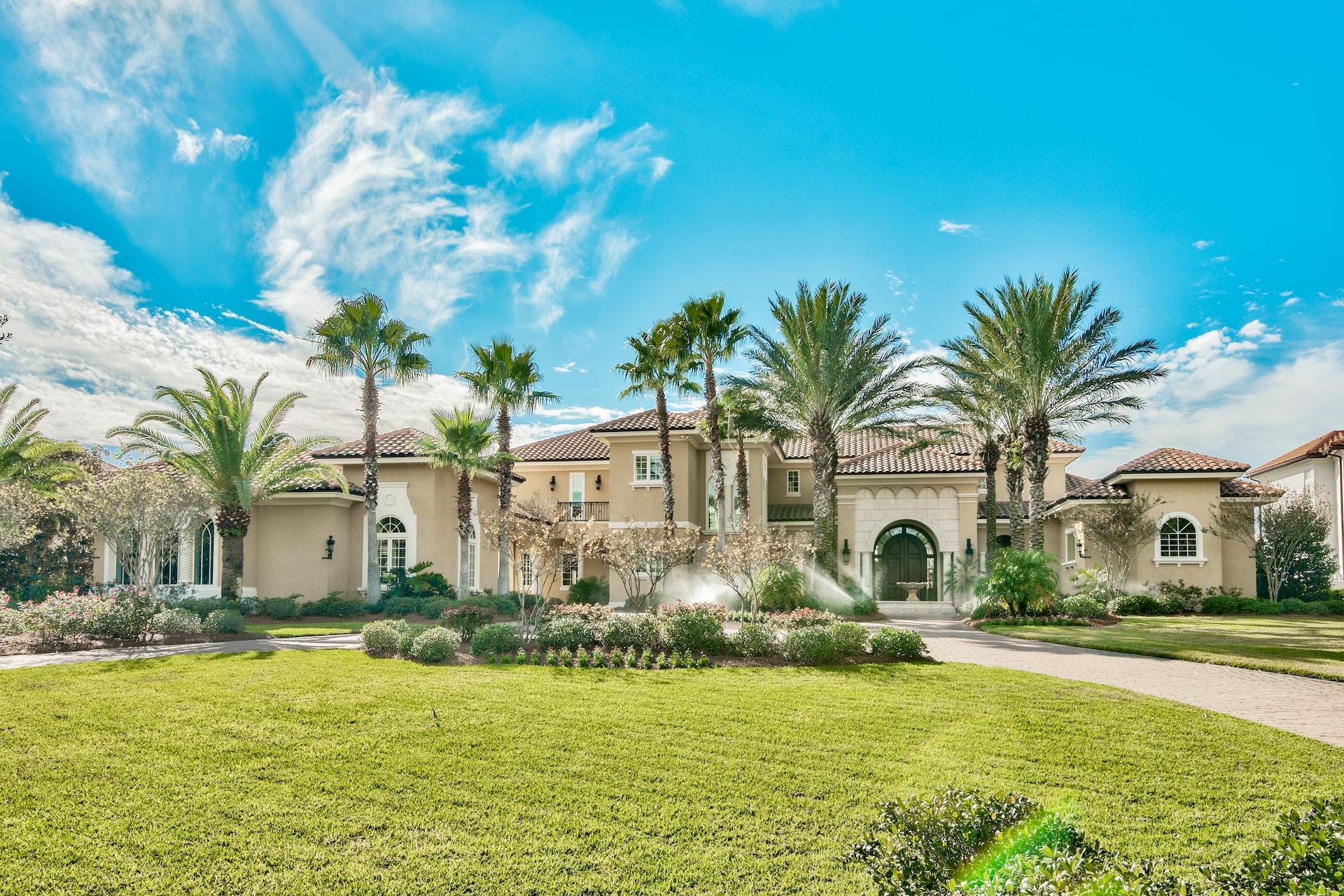 Welcome to Waterford at Kelly Plantation, the exclusive gated waterfront enclave offering estate sized bay or bayou front homesites.This gorgeous custom home is situated on deep water Jones Bayou and offering stunning open bay views as well. Constructed with the finest of materials, superior workmanship and an eye for detail. Great curb appeal, with a large circular brick paver driveway, center water feature fountain, porte cochere, motor court, an oversized two car garage and a separate oversized one car/golf cart garage. Gorgeous double entry doors open into a large foyer with soaring ceilings and the first of many water views. Directly off the foyer is the living room, with two story raised and coffered ceiling, French doors leading to the outdoor space, fireplace. Adjoining is