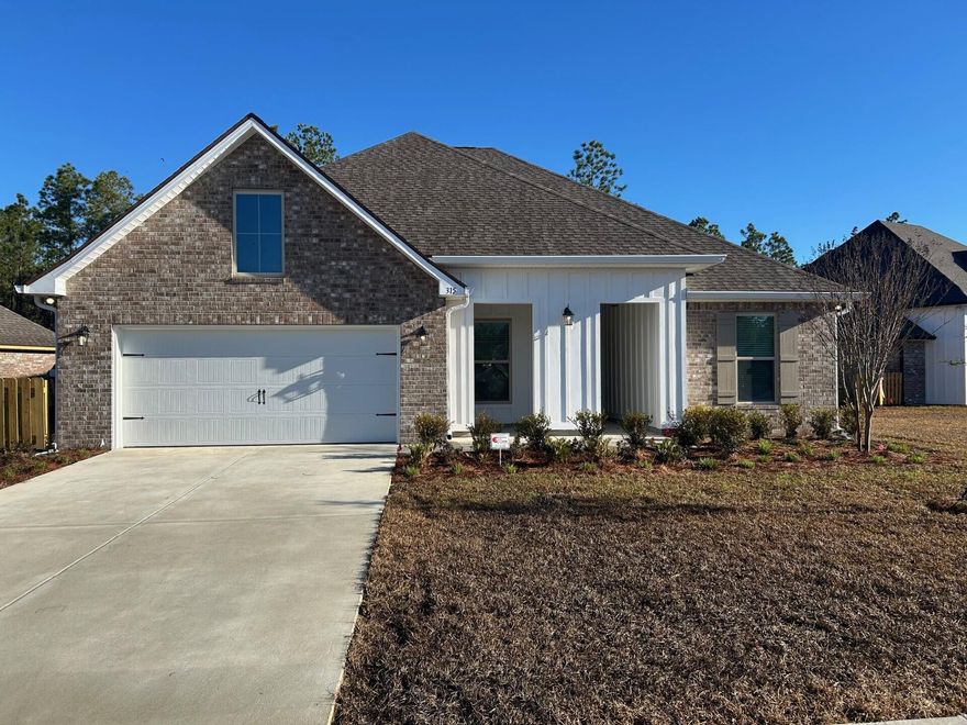 The HICKORY III G in Starburst at Hammock Bay community offers a 5BR, 3BA open design with formal dining room and separate den. Upgrades added (list attached).  Features: double vanity, garden tub, separate custom tiled shower, and walk-in closet in master bath, kitchen island, walk-in pantry, boot bench at garage entry, covered front and rear porch, crown molding, recessed lighting, framed mirrors in all baths, smart connect Wi-Fi thermostat, smoke and carbon monoxide detectors, landscaping package, architectural 30-year shingles, flood lights, and more!Energy Efficient Features: water heater, electric kitchen appliance package, vinyl low E windows, & more! Energy Star Partner.