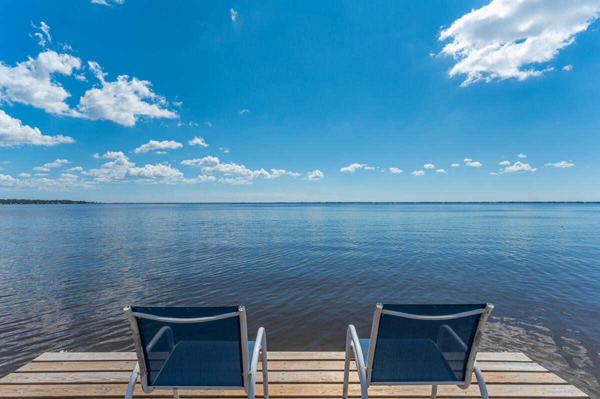 If you love Fishin', Swimmin', Boatin' & Relaxin', you have found it all here!  Rare Bayfront property with 130' on the Bay & 270' in depth, Owner Financing is a possibility, with Seller's approval. This fully bricked home has been meticulously maintained & loved. It features a breathtaking view of Choctawhatchee Bay from the spacious Family Rm, brick fireplace, tile & decorative stamped concrete floors, vaulted ceilings & more. There is an attached carport, a detached garage for cars or boats, & a storage building in the backyard for equipment & water toys! Dock is 120' in length w/boat lift, fish cleaning station & shower. Vinyl seawall & rip rap.  Sunsets to the Western Sky from the 10'x14' Sundeck are incredible & unforgettable!  Take a look at this Bayfront Delight!