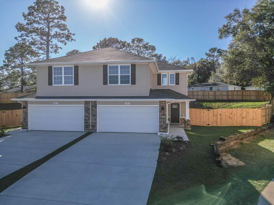 This cottage style, home has a spacious open downstairs floor plan. Kitchen is complete with breakfast bar, pantry, stainless steel appliances all over-looking the Dining area. French doors off the Family room leads you to the privacy-fenced back yard with patio. Upstairs offers a Full Bathroom, Utility room , and  bedrooms. The Master suite includes dual vanities, a large walk-in closet, separate shower and garden tub. Decorative Columns, cedar shake vinyl siding and stone exterior accent the exterior of the home. Home is complete and ready for its new owner.