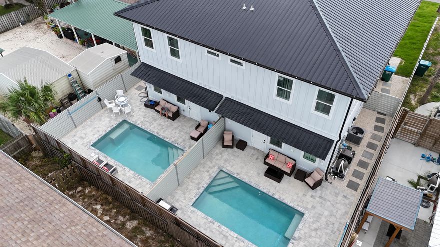 Brand new, fully furnished and decorated 30A-style townhome in the heart of Panama City Beach with stunning Gulf views! This high-quality construction is ideally located within walking distance to the beach, restaurants, and shops--perfect as a primary residence, vacation home, or investment property. No HOA! Enjoy 10' ceilings, 8' doors, and luxury finishes throughout. The spacious floor plan includes a ground-floor bedroom and full bathroom--ideal for guests. Upstairs, the master suite offers a private retreat with a large balcony to soak in the Gulf breeze and salty air. Two additional upstairs bedrooms share a full bathroom. Relax and entertain outdoors with a saltwater heated pool and plenty of space to enjoy Florida's sunshine. Zoned for short-term rentals, this townhome offers excellent income potential in a prime PCB location. Don't miss this incredible opportunityschedule your showing today!