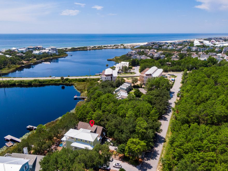 Walk to The Hub, bike to Alys Beach, paddle to the Gulf or relax in one of this home's multiple outdoor living spaces.Built as a cabin on the lake, this 4 bedroom three bath gem has been elevated to a charming and beautiful lakeside retreat. 3 Bedrooms 2 bath in the main house and a one bedroom one bath suite downstairs provide plenty of room for family and friends and a new golf cart garage gives you plenty of space to store your toys!The views of the lake, dunes, and Gulf are just one of the things that make this home truly special.  The shaded back porch has a year-round breeze that comes off of the water, tempering the weather and making outdoor living a true pleasure. Enjoying this home is easy.