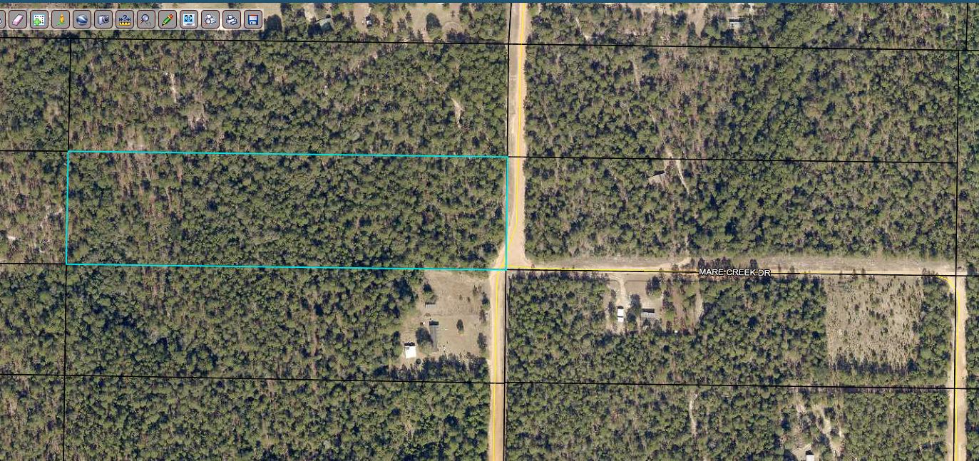 As you walk through the gate you'll notice the land gently slopes, nudging you towards the creek. The creek runs across the back of the property providing a place to cool off in the hot summer days. The land is located about 15 minutes east of the heart of Crestview. Hwy 285 and the Interstate are nearby giving quick and easy access to almost anywhere. Call today to view it. Buyer to verify all information deemed important.