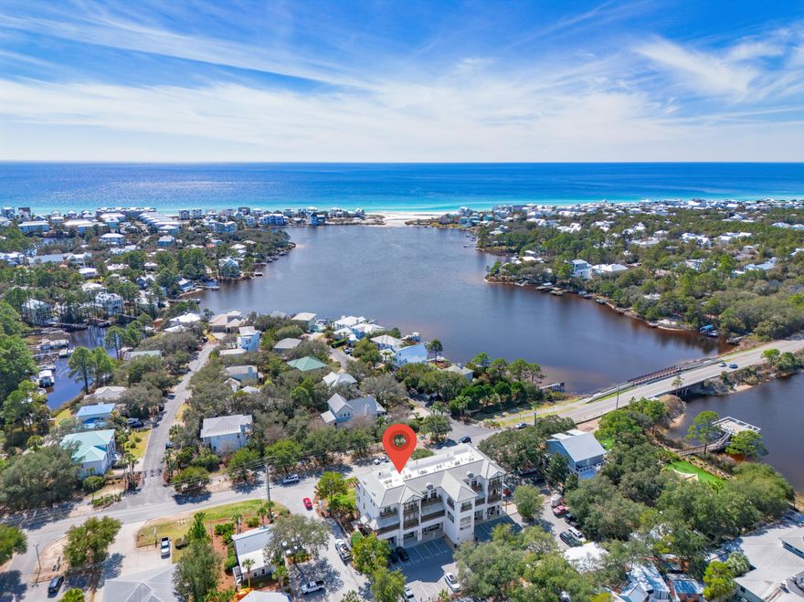 Discover coastal living at its finest in this remarkable two-story condo, perfectly situated in the heart of Seagrove Beach. With 2 bedrooms, 2.5 bathrooms, and upscale finishes throughout, this residence is an exceptional find and would make a perfect primary home, vacation getaway, or investment property. Enjoy stunning views from multiple outdoor spaces, including a private balcony off the primary bedroom on the first level and a large balcony off the living area on the second level showcasing beautiful vistas of the Gulf, Eastern Lake, and vibrant sunsets. Located less than a mile from two beach accesses: Walton Dunes and Eastern Lake, and within half a mile from Eastern Lake Boat Ramp, this condo is perfectly positioned for 30A's greatest outdoor adventures! Step inside to find travertine tile on the first level and hardwood floors upstairs, complemented by soaring 10' ceilings. You are welcomed into the large foyer spacious enough for twin bunks maximizing the sleep capacity. The first level consists of both bedrooms, 2 full bathrooms, and laundry closet with full-size washer & dryer for added convenience. The primary bathroom features a walk-in travertine tile shower with glass door while the guest bathroom offers a shower/tub combo with subway tile surround for those who enjoy a relaxing soak. The guest bathroom can be accessed directly from the guest bedroom and the hallway. The owner's closet located off the foyer is decent in size and keeps your personal valuables and beach gear secure. 

Upstairs the gourmet kitchen boasts granite countertops, antique subway tile backsplash, under-cabinet lighting, a large pantry, stainless steel appliances, and top-of-the-line Viking fridge and 4-burner gas range with griddle and range hood. The expansive living and dining areas are quintessential for hosting a large gathering of family and friends. A lovely Juliet balcony off the dining area adds to the condo's charm.

Eastern Lake Village consists of 6 condos in a low-density building with an elevator enhancing privacy and accessibility. The condo is just upstairs from Buddy's Seafood, a staple for fresh seafood and revered recipes, and local favorites like Old Florida Fish House, Coastside 30A, and Beachy Bean Coffee are practically in your backyard. Greenway Station is a nearby hub with several great dining, shopping, and fun entertainment options. With a beach access, boat ramp, and state park all within a mile from the condo, you're just a short bike or golf cart ride from 30A's white sand beaches, unique coastal dune lakes, and hiking trails. Surrounded by Grayton Beach State Park, Point Washington State Forest, and Deer Lake State Park, Seagrove offers boundless natural beauty! Venture just 3 miles west to Seaside to enjoy weekly farmers' markets, retail therapy, and top-tier dining. Come discover why this condo's prime location makes it such a coastal gem!