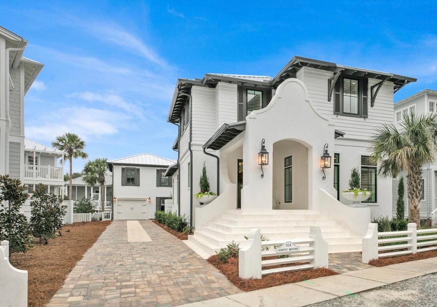 NEW! A rare find!---a brand new home, with striking curb appeal, completed in 2021,  and coupled with a remodeled pre-existing separate guest cottage/garage.  Without exaggeration, this beach home is the finest interior home offered on the open market in Carillon in several years.  AND it is situated a mere four homes from the beach walkover.  This stunning Carillon Beach home features a total of  6 BR (4 in main house) and 5 1/2 baths tastefully and functionally fashioned from 3700 SFT of H/C space.  Whether you are looking for a permanent home, second home or investment property, this part block/stucco beach home satisfies all your desires. The spacious open-concept great room/kitchen-dining area spills onto an equally grand outdoor entertainment area with grill and outdoor kitchen.