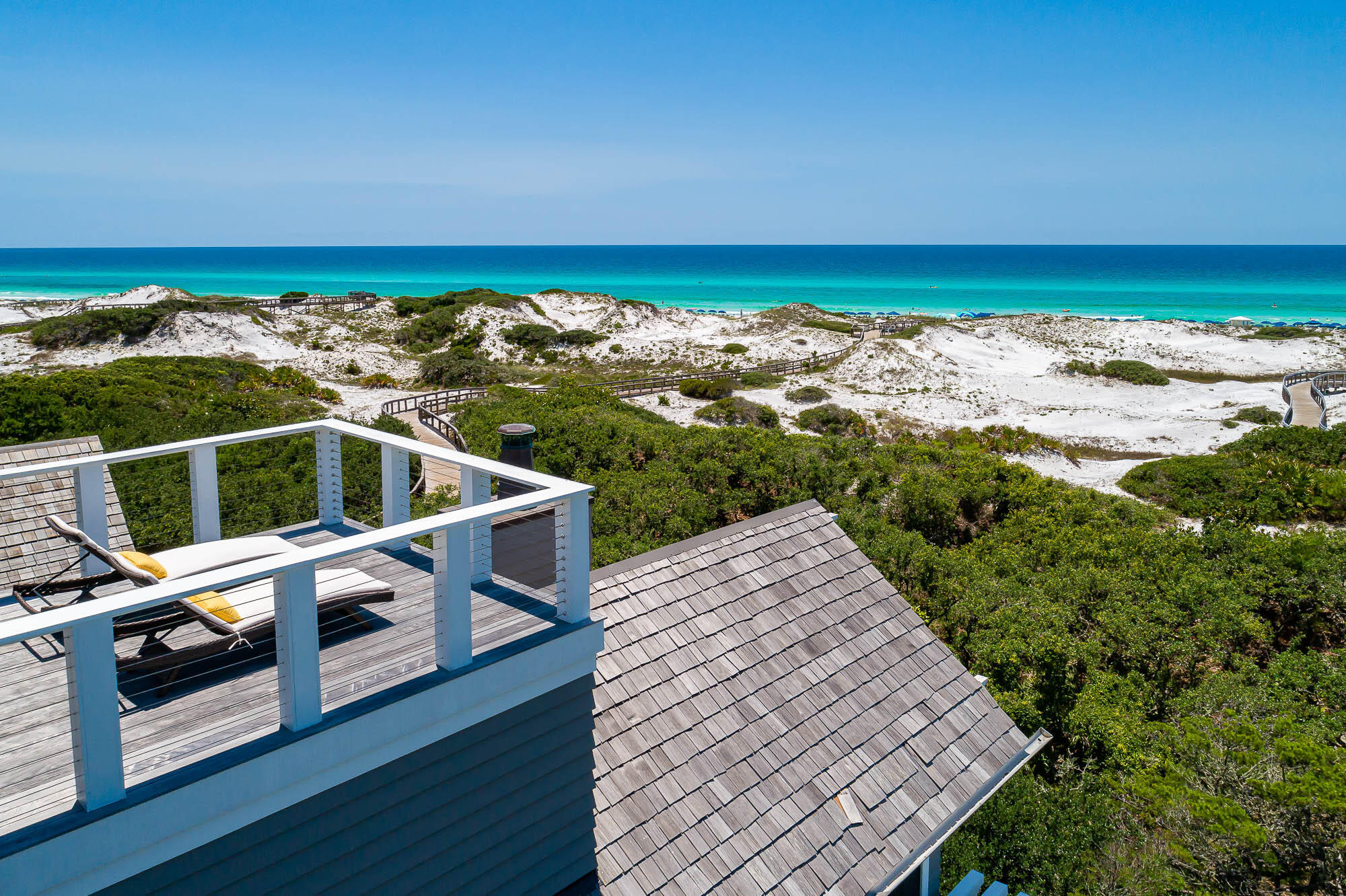 Poised Gulf-front in the gated community of Watersound Beach, 114 S Watchtower Lane boasts quintessential coastal living. Situated on the iconic sprawling dunes, this immaculate beach home with private pool is just steps from the beach and a short bike or golf cart ride to the coveted Watersound Beach Club. A talented and renowned team, comprised of architect Tyler Doin and builder Regal Stephens Construction, created the ideal luxury beach house, exuding a high level of elegance while maintaining the natural elements of comfortable coastal design. Four spacious floors feature numerous balconies that provide breathtaking views of the sugary sands and crystal clear waters of the Emerald Coast.Upon entering through the custom Mahogany doors, you are well greeted by a tall foyer with