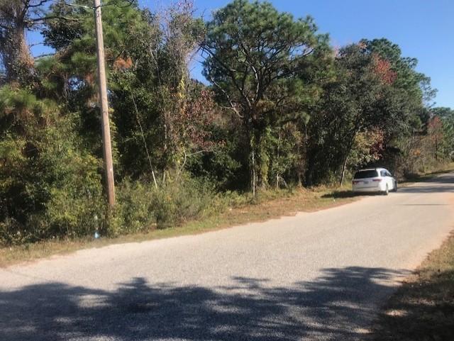 Endless possibilities for this half acre vacant lot. Possibly split the lot for several homes. There are many new houses being built in the area. Property also has small pond that previous owner many years ago stocked with fish. (we do not know if there are any still in there).. Please verify all information.