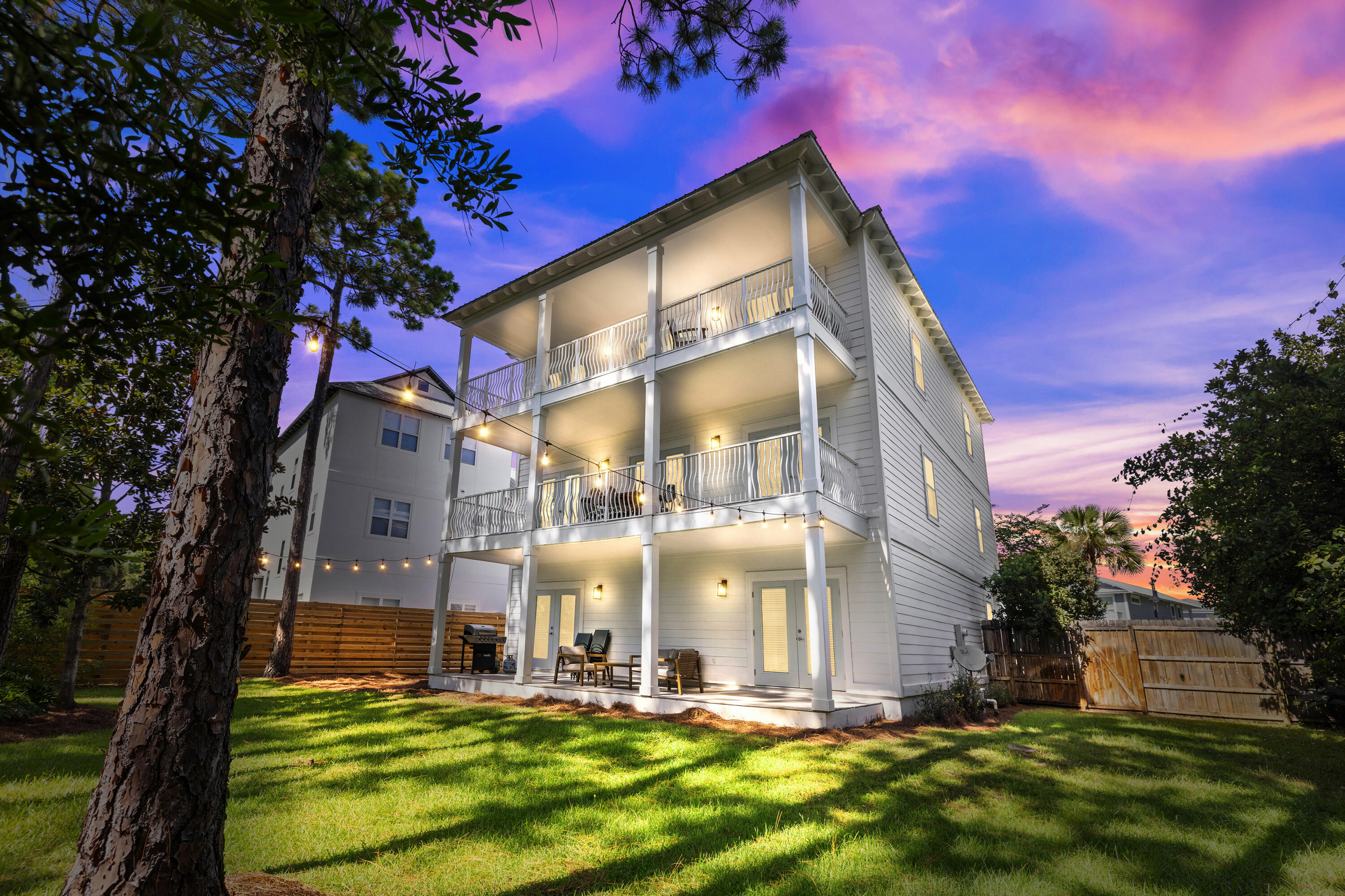 Welcome to 33 Cherry Laurel Drive, your dream getaway just minutes from the stunning sugar-white sands of 30A. This spacious six-bedroom home stretches over 3,400 square feet on a cozy 0.26-acre lot, with plenty of room to add a pool if you want! It's perfect whether you're looking for a main home, a vacation spot, or a rental property, and it even comes fully furnished.The place is packed with smart features like dual pane windows, two central AC units, and a smart thermostat to keep things comfy all year round. The recessed lighting and cool architectural touches set the mood just right. On the first floor, you'll find a comfy bedroom and a Jack-and-Jill bathroom that leads to another bedroom and the garage. Head up to the second floor, and you'll find a super chill living and dining area that's perfect for hangouts, along with a modern kitchen that's ready for action.
On the third floor, there's a luxurious master suite with a private porch, where you can enjoy amazing sunset views through the pines. There's also another bunk bedroom up there for extra space.