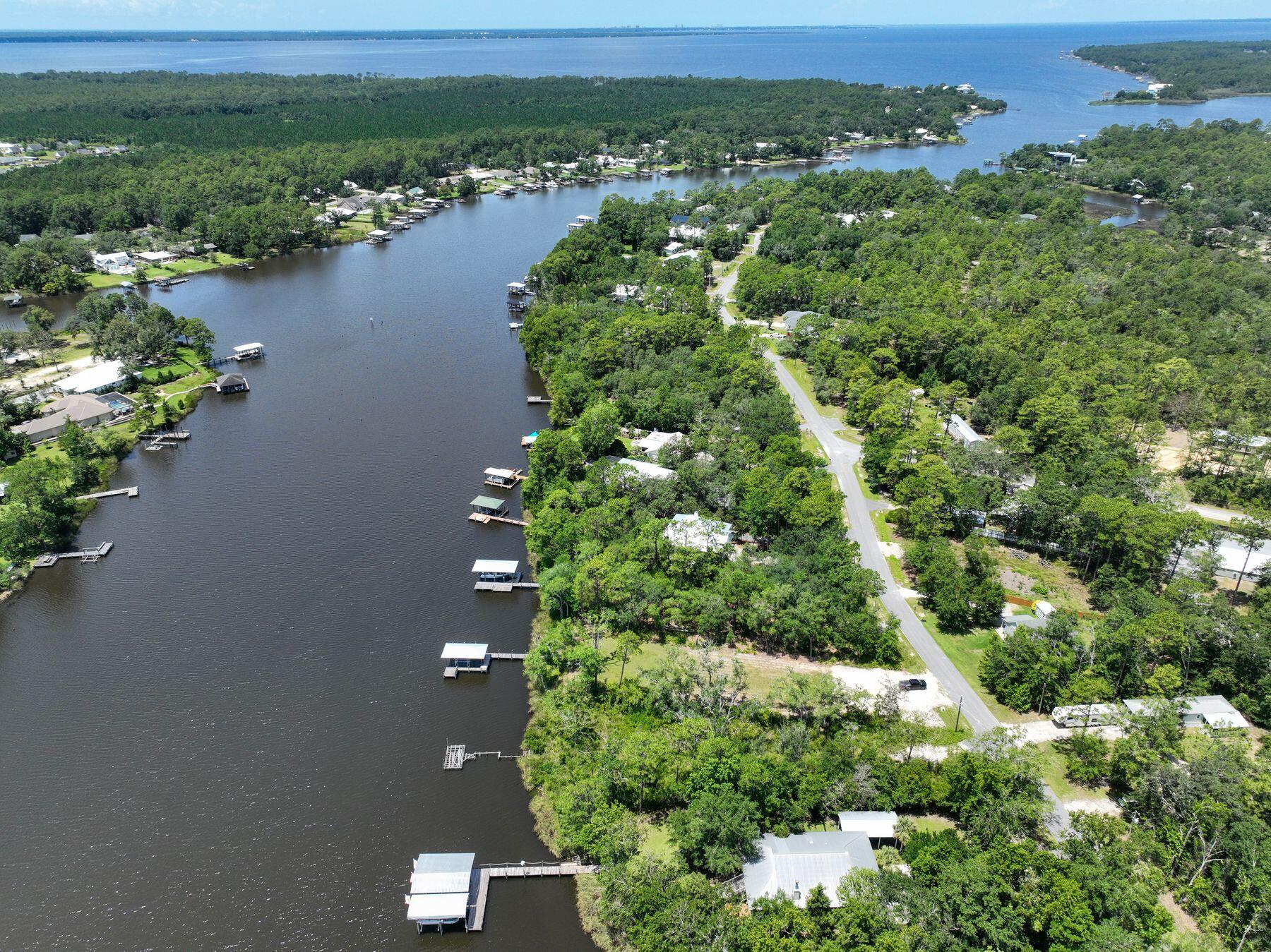 Spectacular deep water lot on Mallett Bayou in Freeport, one of the fastest growing areas in Florida. Featuring 100 feet of waterfront, over a half-acre in size with beautiful oak trees on a quite street with no HOA, this represents an excellent opportunity to build now or buy and hold for the future.