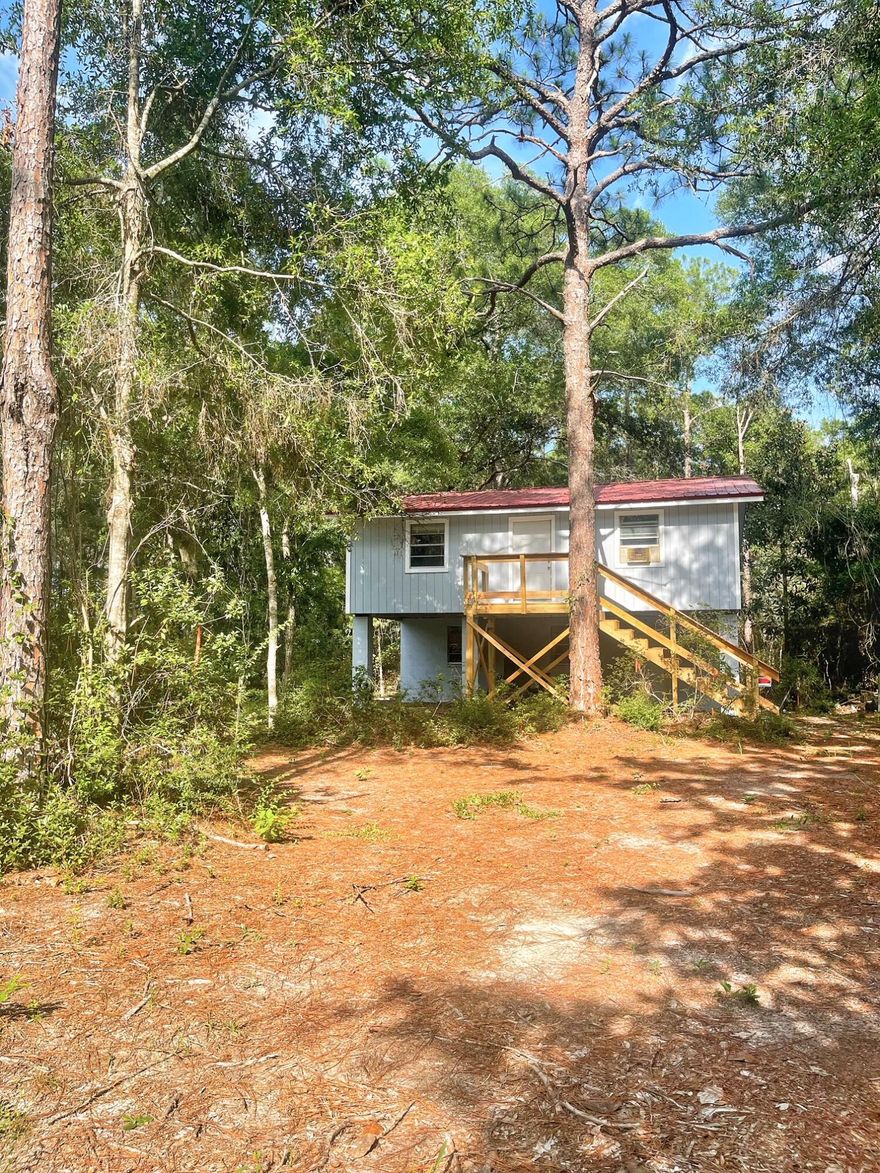 This split level home needs a little TLC and someone to bring it back to life. It's located on 1.6 beautiful acres with Cat Island park just around the corner. Cat Island park offers docks to fish from or boat launches to launch your boat. The sellers have recently painted the exterior and added a new deck and stairs. Due to the repairs this home needs, offers will need to be cash or conventional loans only. Buyer to verify all measurements to own satisfaction.