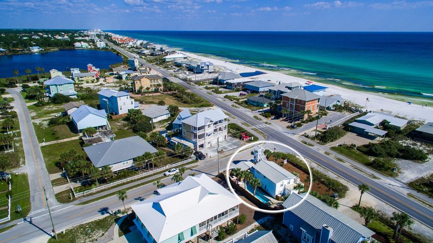 Enjoy splendid sunsets and cool ocean breezes from this charming 5 bedroom, 3 bath home in Santa Rosa Beach. With tremendous outdoor space, including sparkling pool and a three story tower with exceptional gulf views, this one of a kind property is immaculately maintained and just steps from the beach yet near Santa Rosa Golf Club and Oyster Lake.
Step inside from the oversized front porch to the spacious living area with ceramic tile, beamed ceilings, and columned archways. The private master suite offers a relaxing sitting area as well as ensuite bath with custom tiled walk in shower and ample storage. An additional guest room with separate bath has access to the outside pool area. A spiral staircase takes you up to the second floor which leads to a cozy entertaining area with open breakfast bar that looks into the upgraded kitchen featuring stainless steel appliances, granite countertops, center island and sitting area.  Three additional guestrooms will exceed your entertaining and living needs.  The second level oversized balcony leads to impressive tower for exceptional water views. This is your chance to live the sought after Florida lifestyle!