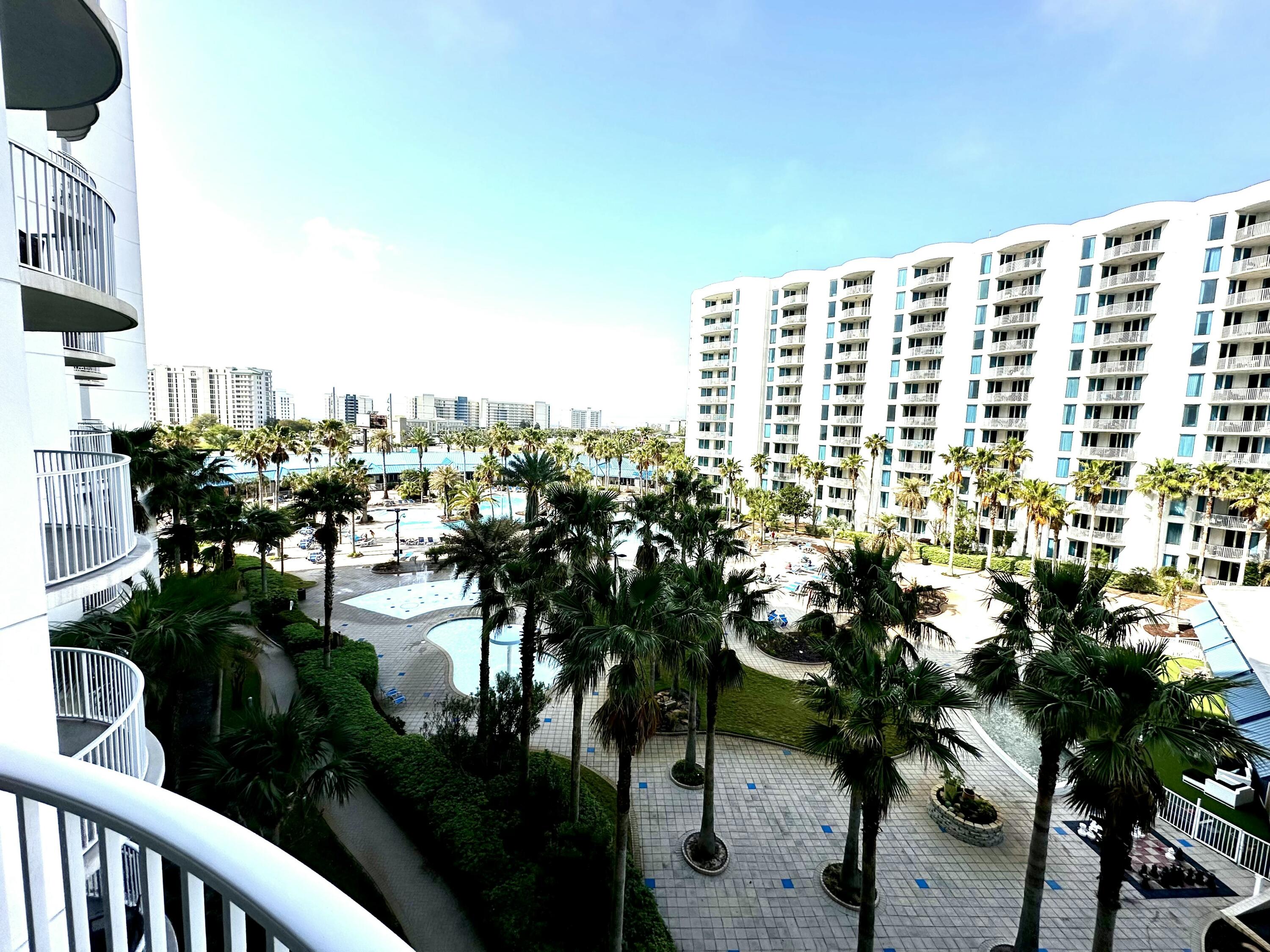 Come enjoy the beautiful pool views from this two bedroom, two bath unit in Tower 1 at The Palms of Destin. This resort features and onsite restaurant, a pool bar, hot tub, and a large resort style pool, as well as tennis, pickelball, basketball, and a childrens playground. Located one block from the worlds most beautiful beaches, you and your guests will truly enjoy your time at this special resort. New HVAC installed in 2022, and new sleeper sofa in the living room. The master bedroom features a new mattress and has poolside views and the spacious living area is perfect for hanging out in the evening and catching movie or sunset. The gated garage offers covered parking, and the resort is surrounded by various restaurants and shopping. It's time to make this beauty your own.