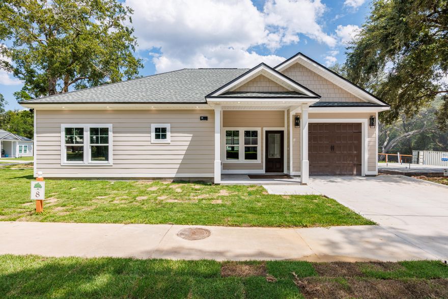 Offering $10,000 Flex Money!!!Welcome to The Magnolia Cottage Model, a beautifully designed, custom-built 2 Bedroom/2 Bathroom home with a garage, located in the tranquil and growing community of Live Oak Cottages in Freeport, Florida. This stunning residence offers a perfect blend of modern luxury, energy efficiency, and stylish finishes, making it an ideal place to call home.Key Features:Durable Construction & Premium Materials-Built on a solid 3000 PSI concrete slab with a 7/12 roof pitch, this home ensures both long-lasting durability and superior weather resistance. The exterior is finished with low-maintenance Cementous Hardie Board siding, complemented by Polygene fiberglass-insulated windows and doors to enhance energy efficiency. Modern & Efficient Interior- Inside, the home boasts 10-foot ceilings that create a bright and open atmosphere. The open-concept floor plan seamlessly connects the kitchen, living, and dining areas, making it perfect for both entertaining and everyday living. Luxury Vinyl Plank (LVP) flooring runs throughout, while custom cabinetry, a gourmet kitchen with quartz countertops, and stainless-steel appliances bring both style and functionality.

Spacious Bedrooms & Luxurious Bathrooms- The primary suite features a luxurious en-suite bathroom with a double vanity, quartz countertops, and a roll-in tiled shower for ultimate relaxation. The second bathroom offers a deep soak tub with a tiled shower combination, making it perfect for unwinding after a long day.

Outdoor Living at Its Best- Enjoy the 12x10 tiled and screened back porch, ideal for year-round relaxation. The fenced backyard offers privacy and security, while two exterior water faucets provide added convenience for outdoor chores or gardening.

Energy-Efficient Systems- This home is equipped with a 2-ton, 15 SEER HVAC system with a programmable thermostat for optimal comfort year-round, as well as a 40-gallon hot water heater to meet all your utility needs.

Prime Location- Live Oak Cottages is ideally situated in Freeport, FL, offering a quiet, serene setting while being just minutes from vibrant local shopping, dining, and schools. You're also less than 25 minutes from the beautiful beaches of 30A and the stunning Emerald Coast.

Don't miss this opportunity to own a thoughtfully designed, energy-efficient home in one of Freeport's most desirable communities. Schedule your private showing today!
