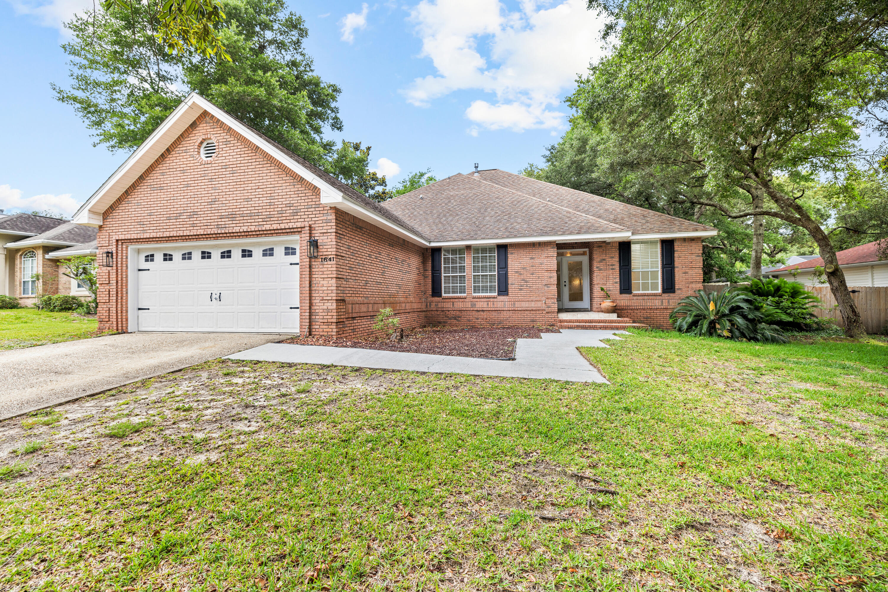 Discover the perfect blend of warm colonial hospitality and brick construction in this 4 bedroom, 3 bathroom home located in the gated community of Parkwood Estates. Spanning 2,433 square feet, step inside to a welcoming foyer and admire 9' ceilings and elegant columns that accentuate the formal dining room and great room. The space is enhanced by a gas log fireplace, a convenient we bar, and durable laminate flooring. The adjacent family room features tall windows built-in seating with storage, creating an ideal spot for reading, relaxing, or watching TV.The master suite is a true retreat with a spacious bath and double vanity, a garden tub, a separate shower, and walk-in closet. An additional downstairs bedroom offers versatility and can be used as an office or guest room. *Background, credit checks
*This property is not pet friendly
*Move out clean fee
