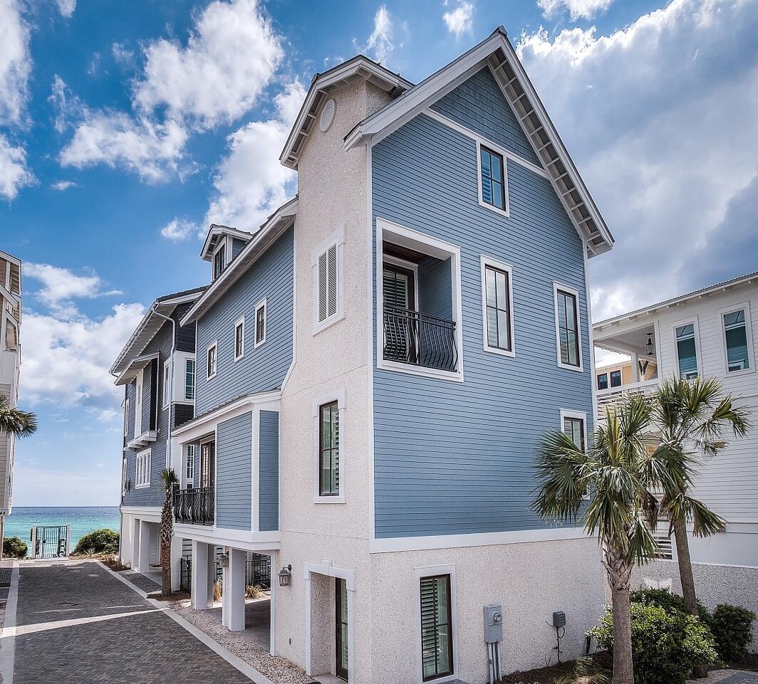 Welcome to 244 Winston Lane - Exquisitely located near the Gulf in Inlet Beach, this property is designed with a luxurious 30A lifestyle in mind. As you enter the driveway to the residence, you are greeted by a view of the Gulf just outside the private beach access for the Bluffs at Inlet Beach neighborhood. Offering covered parking & a reserved parking spot outside, the ease of access to this property is magnificent. You are greeted by a foyer, perfect for tossing off your flip flops. And upstairs resides a masterful kitchen with gorgeous white marble countertops & plenty of bar-seating. The living space is furnished perfectly with elegance at heart. Just off the formal dining area is a private balcony, perfect for unwinding and taking in a view of the Gulf.