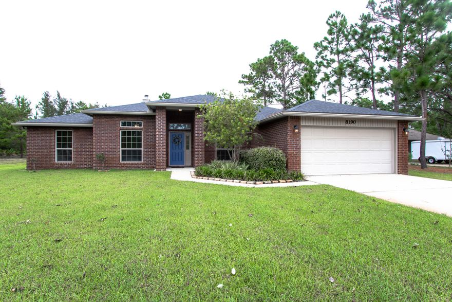 Pristine 5 bedroom, 3 bathroom home with a split floorplan in a quiet neighborhood. The open floor plan is perfect for any size family and you can entertain guests in the spacious kitchen and living room by the fireplace. Plus, you'll love the large and beautifully landscaped yard. It is located just West of the Navarre Beach Causeway and there's NO HOA! Close to shopping, beaches, restaurants, Hurlburt Field, I-10, and more!